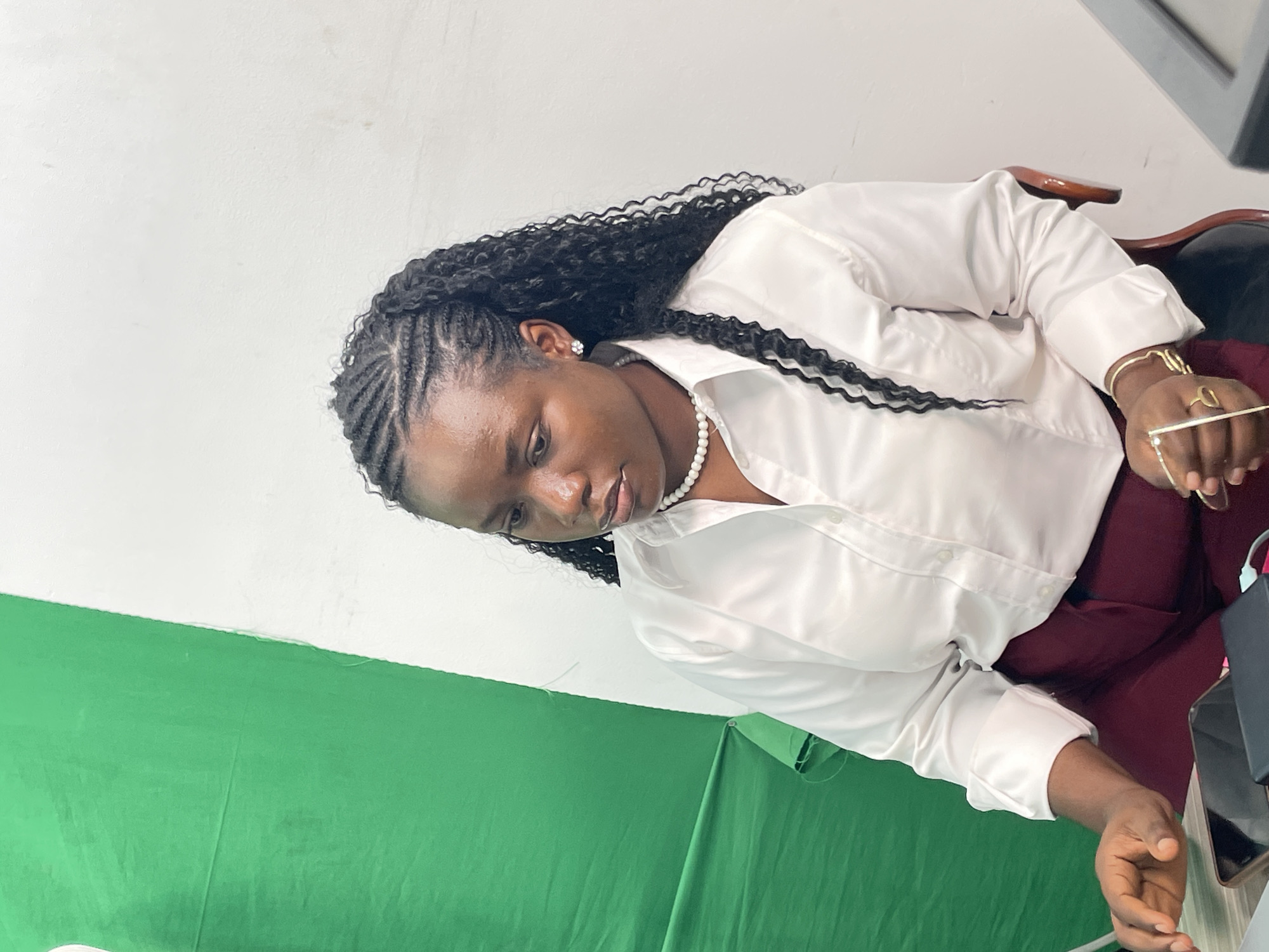 Studio portrait session underway in Abuja, green screen setup