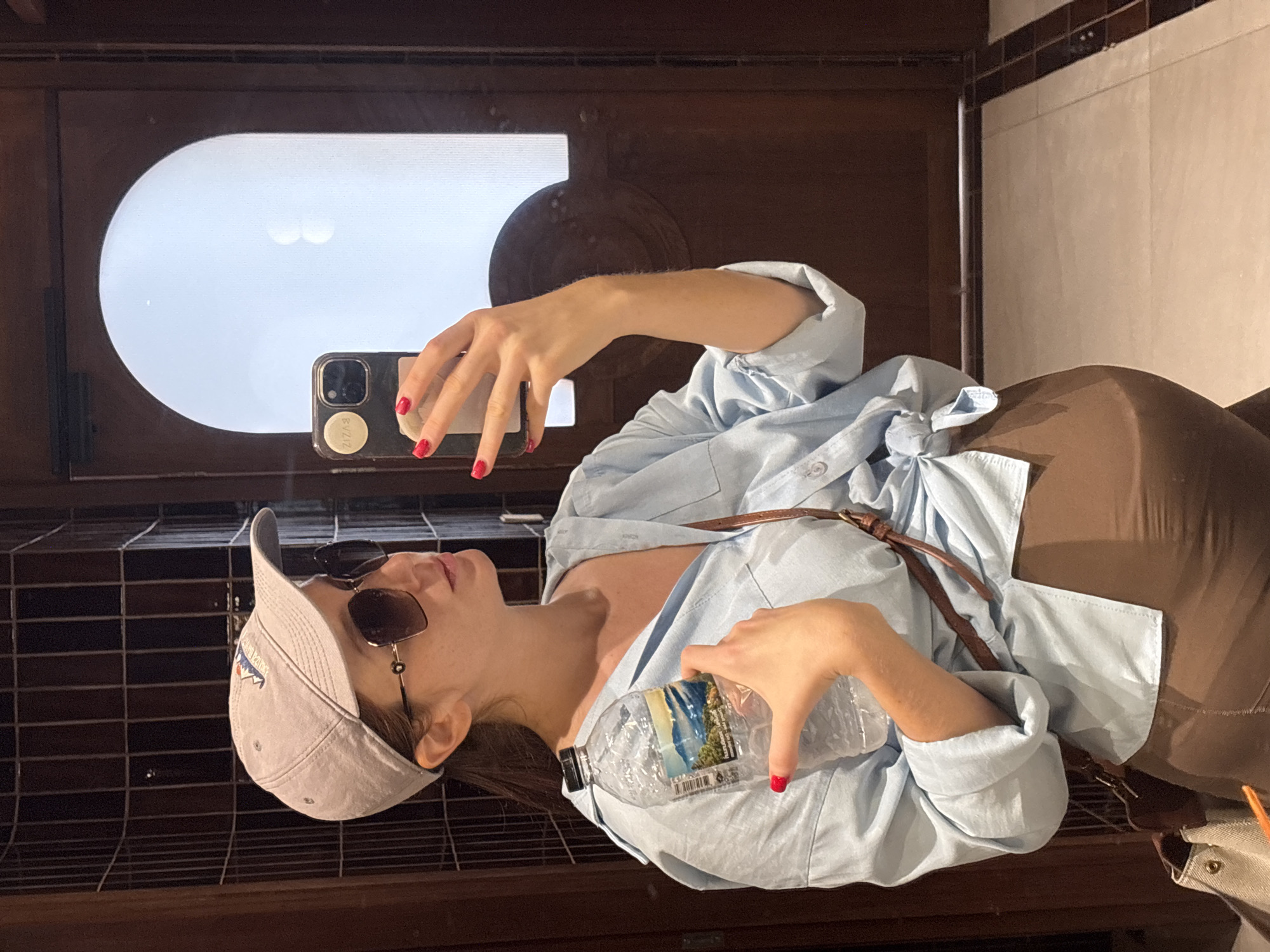 Woman takes bathroom selfie in Choeng Thale, Thailand