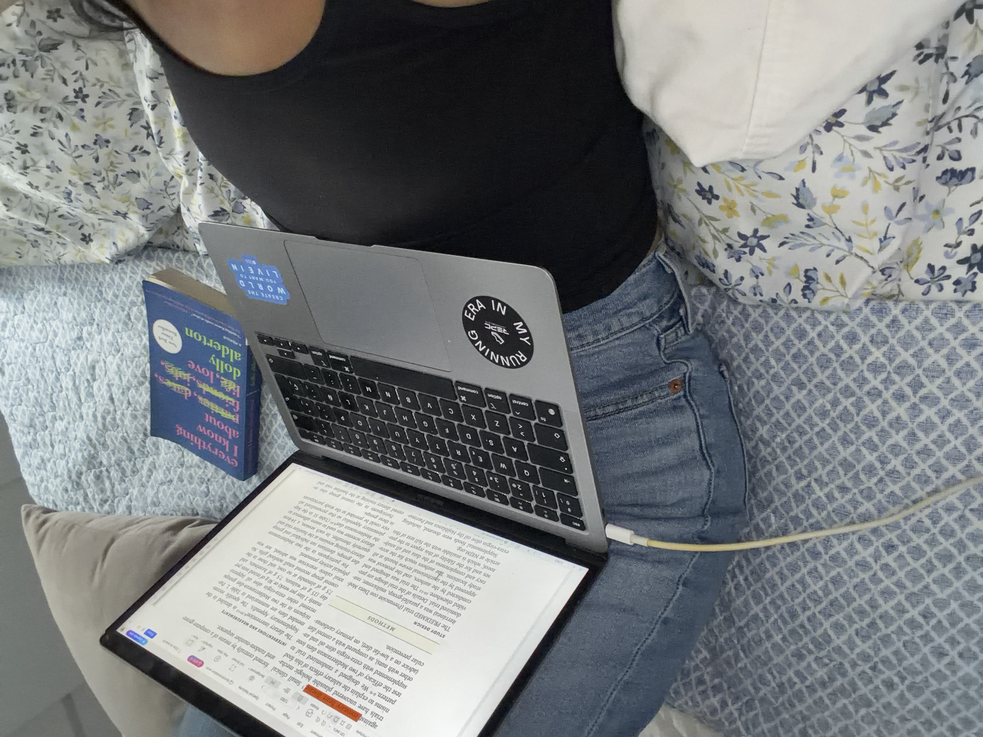 Laptop and book evening on a patterned bed in Mexico