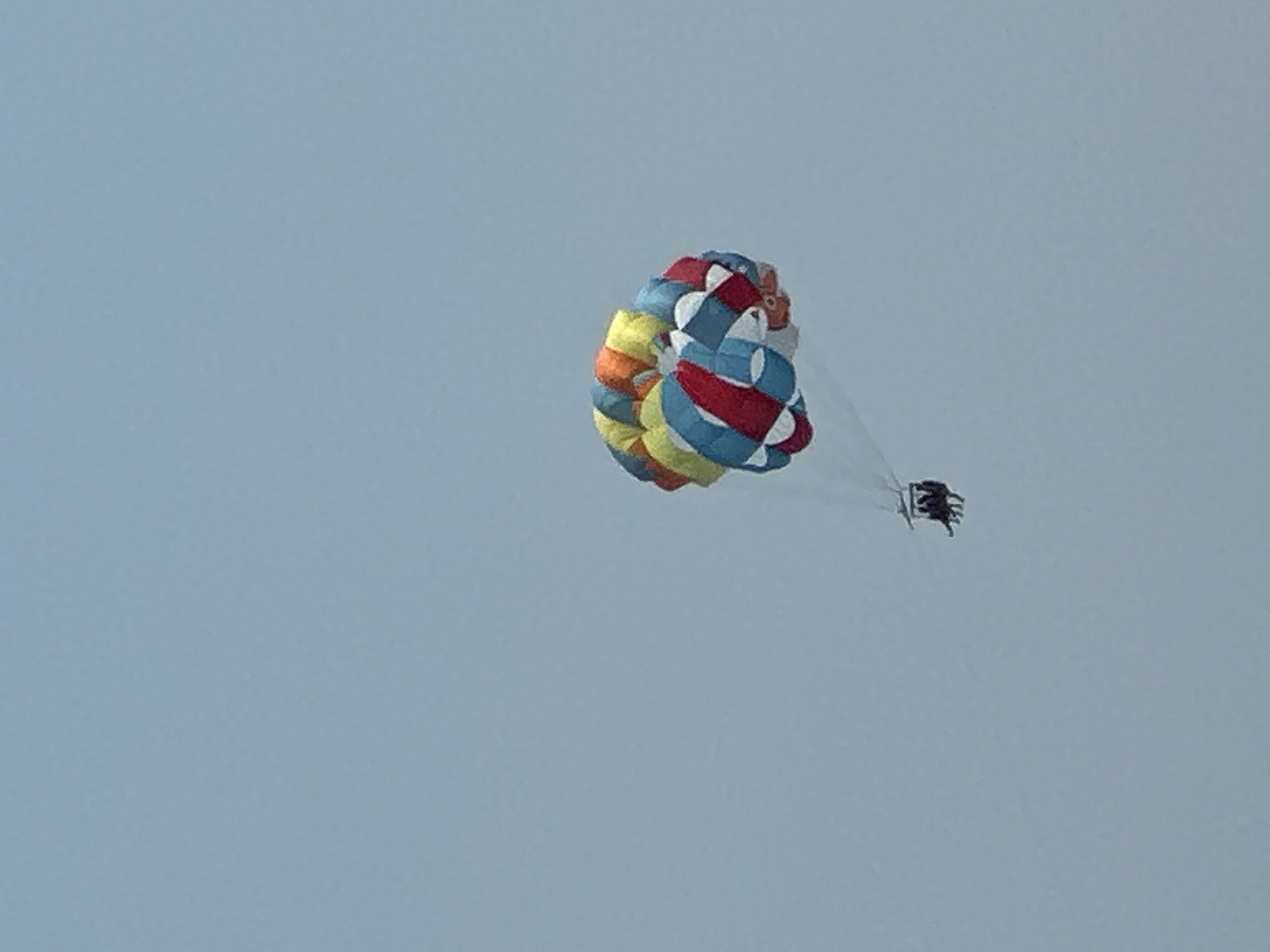 Parasailing over calm Adriatic waters off Boreti, Montenegro