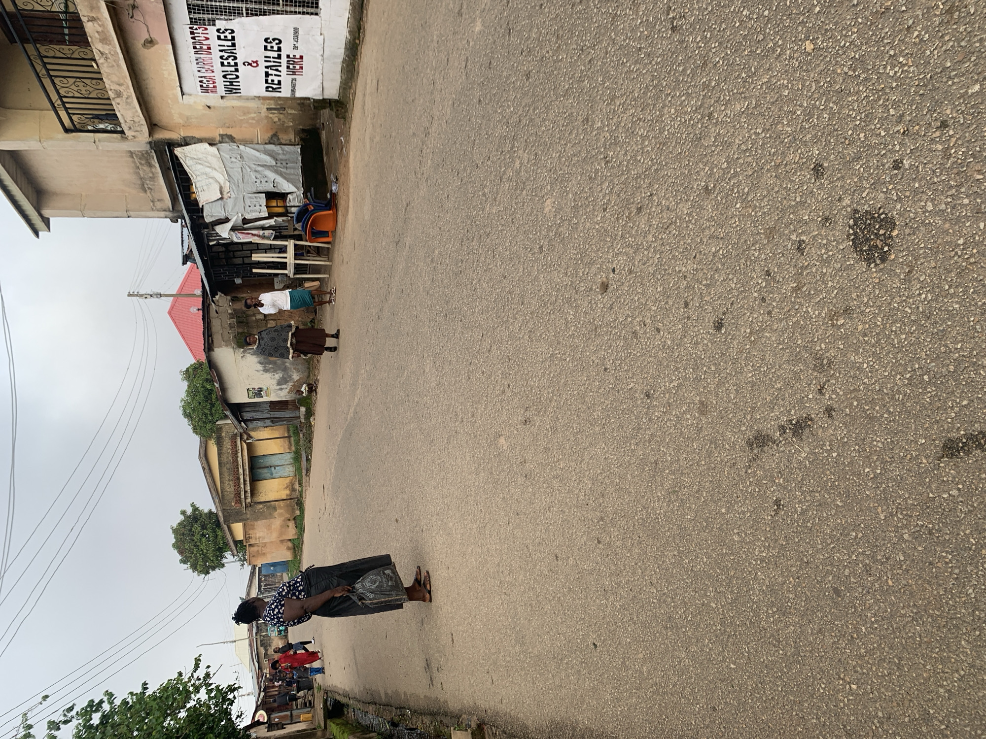Morning street life in Jos, Nigeria — commuters, kids, and Keke Napeps