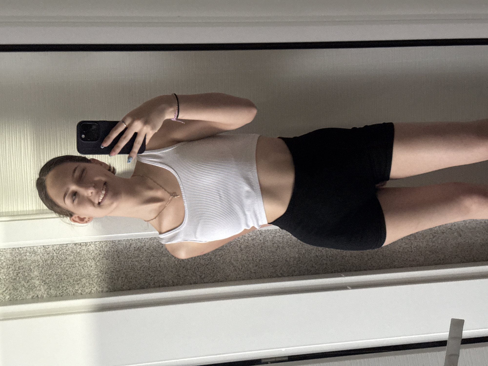 Young woman takes multiple selfies in Sofia apartment