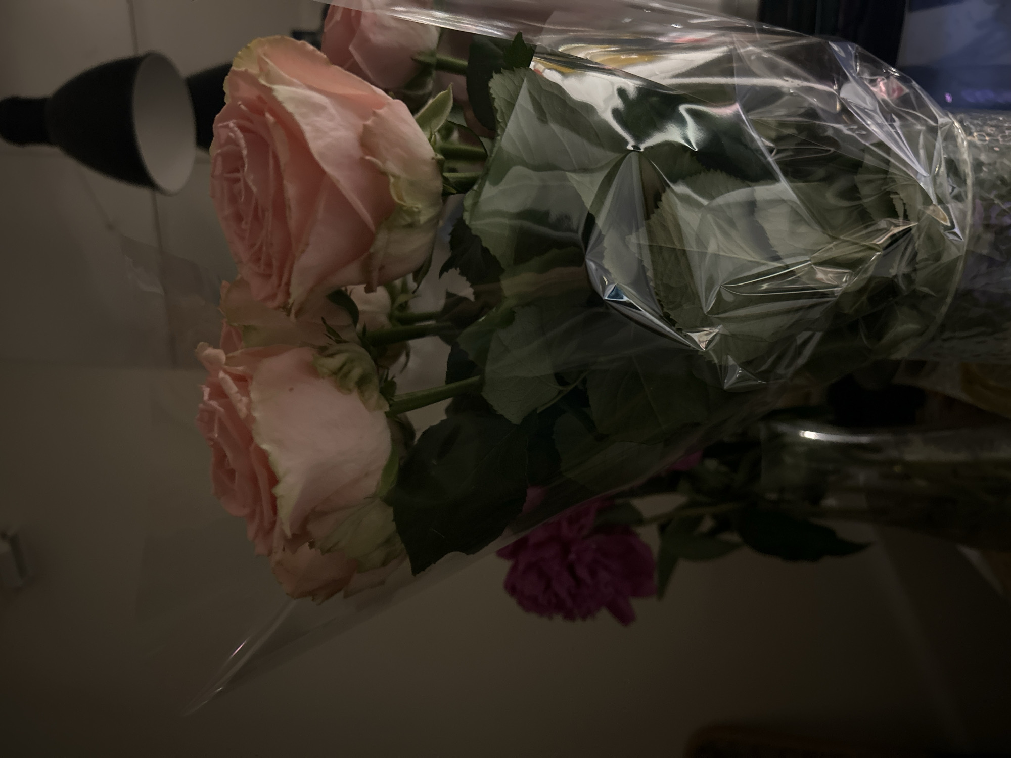 Pink rose bouquets documented at Moscow indoor gathering