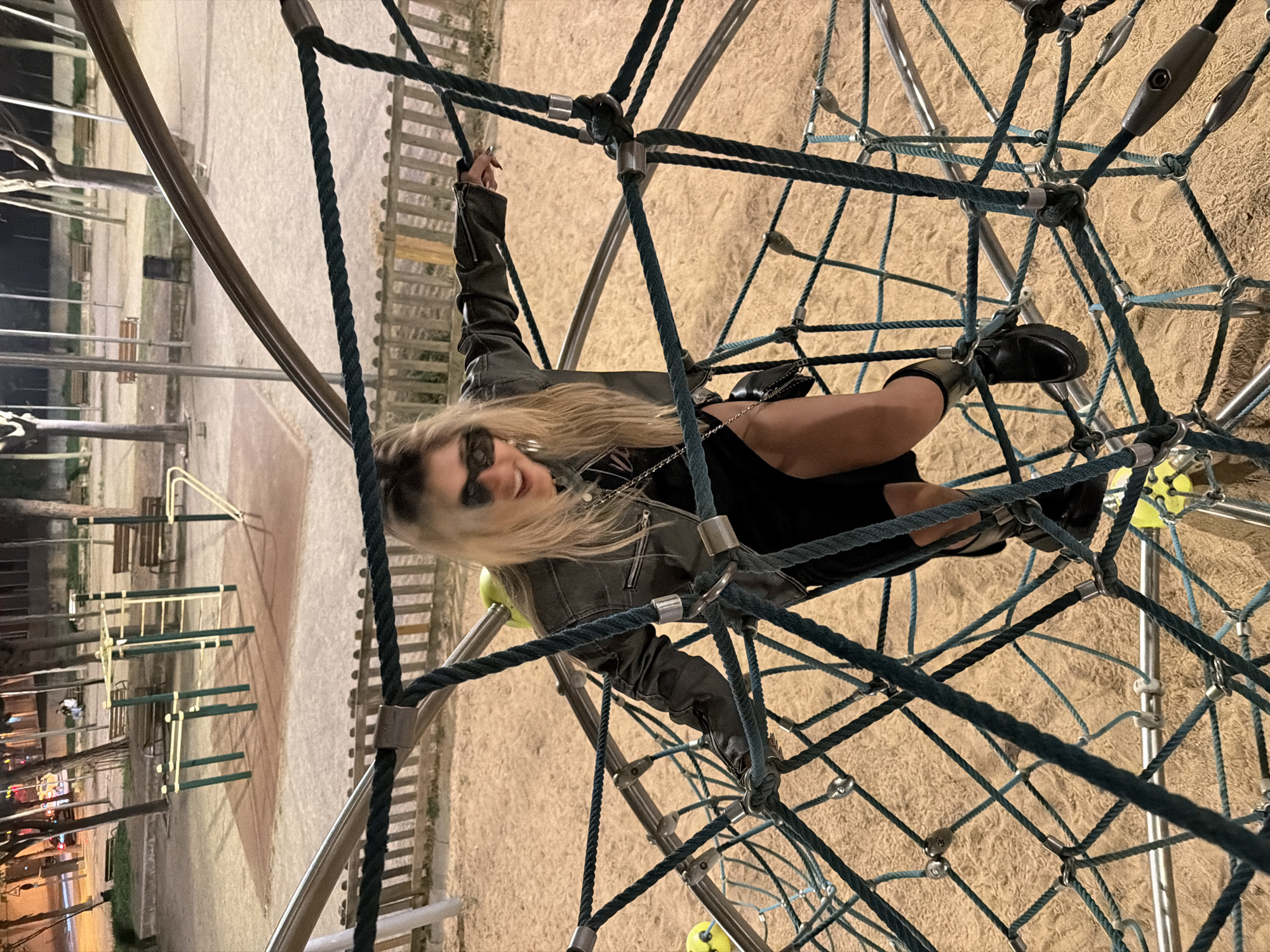 Two people play on Barcelona playground equipment