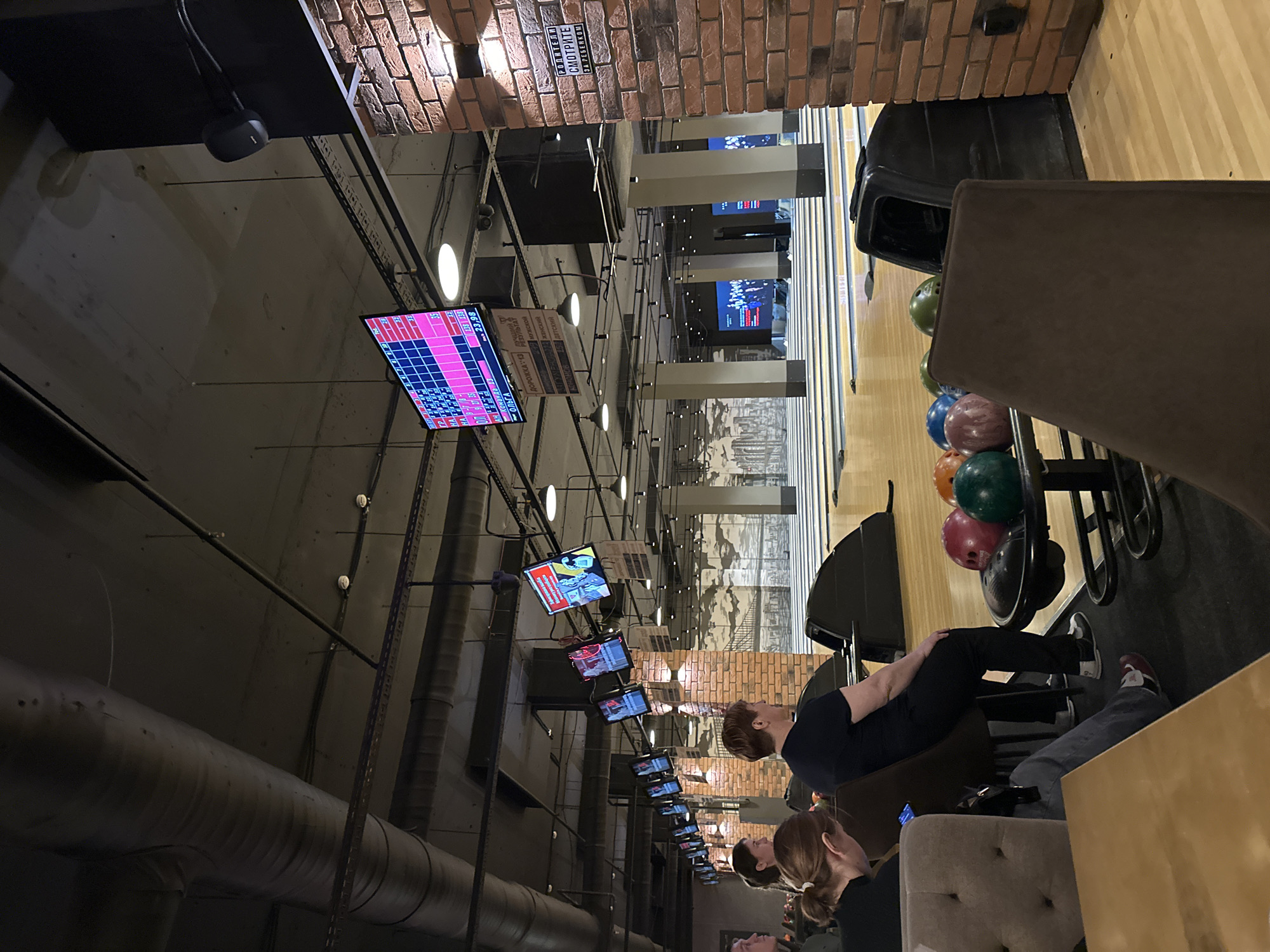 Woman enjoys bowling and dining at Izhevsk recreation center
