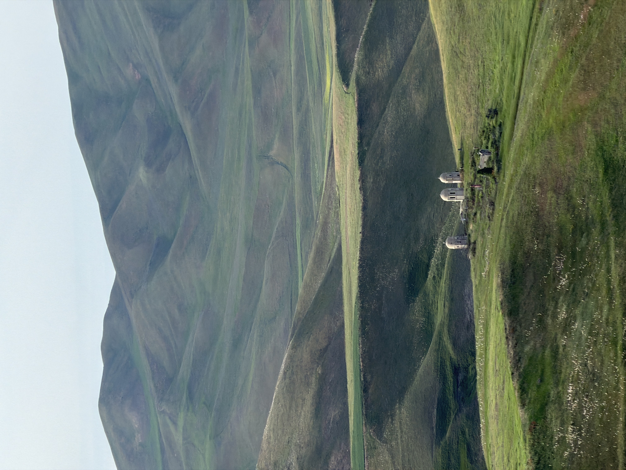 Rolling hills and farmland of Toguz-Bulak, Kyrgyzstan in summer