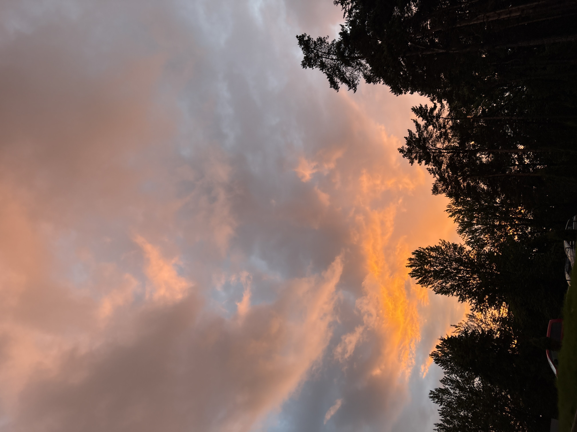 Dramatic sunset with orange-pink clouds observed across Minsk neighborhoods