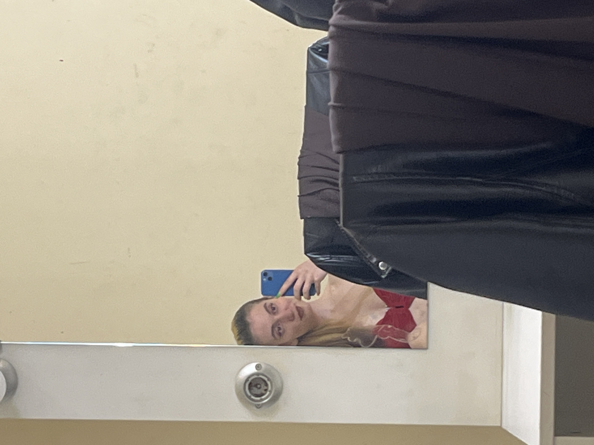 Woman Takes Mirror Selfies with Blue Phone in Plovdiv