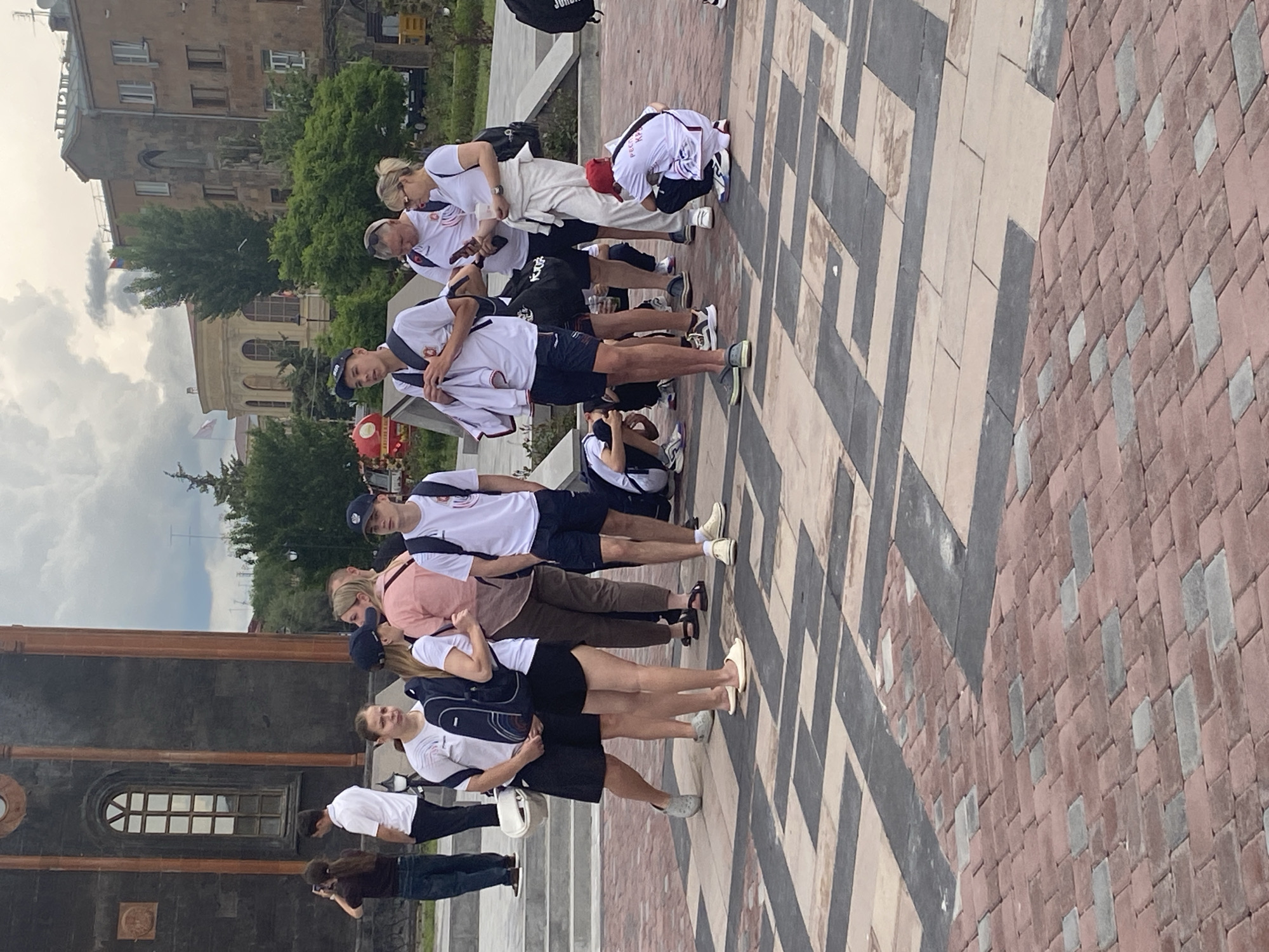 Group gathers outside historic stone building in Gyumri