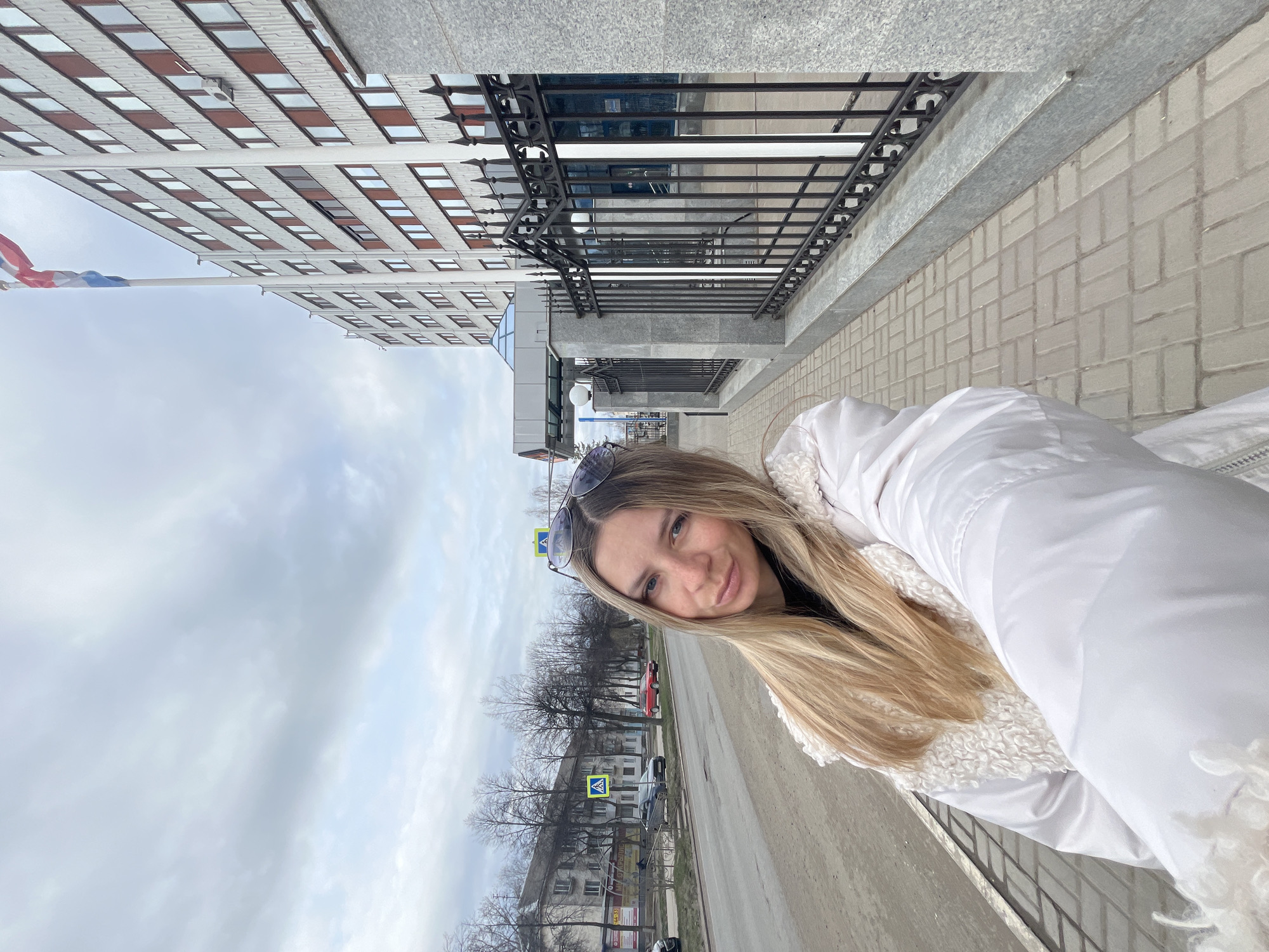 Woman photographed at Chaikovsky district administration building, Russia
