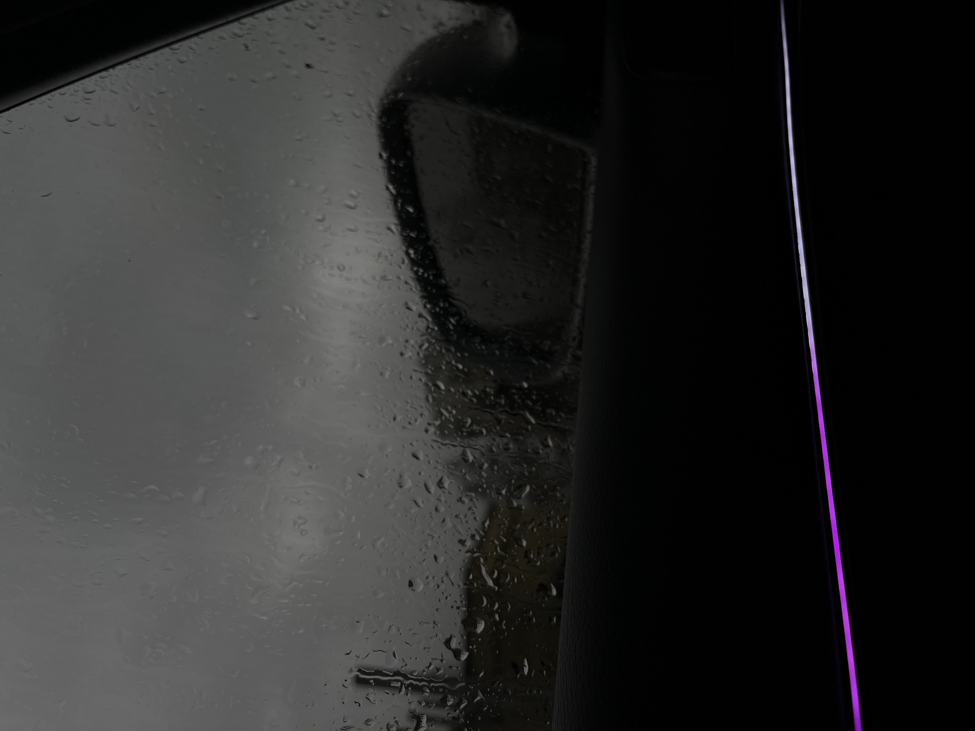 Rainy car window with mirror reflection photographed in Vratsa
