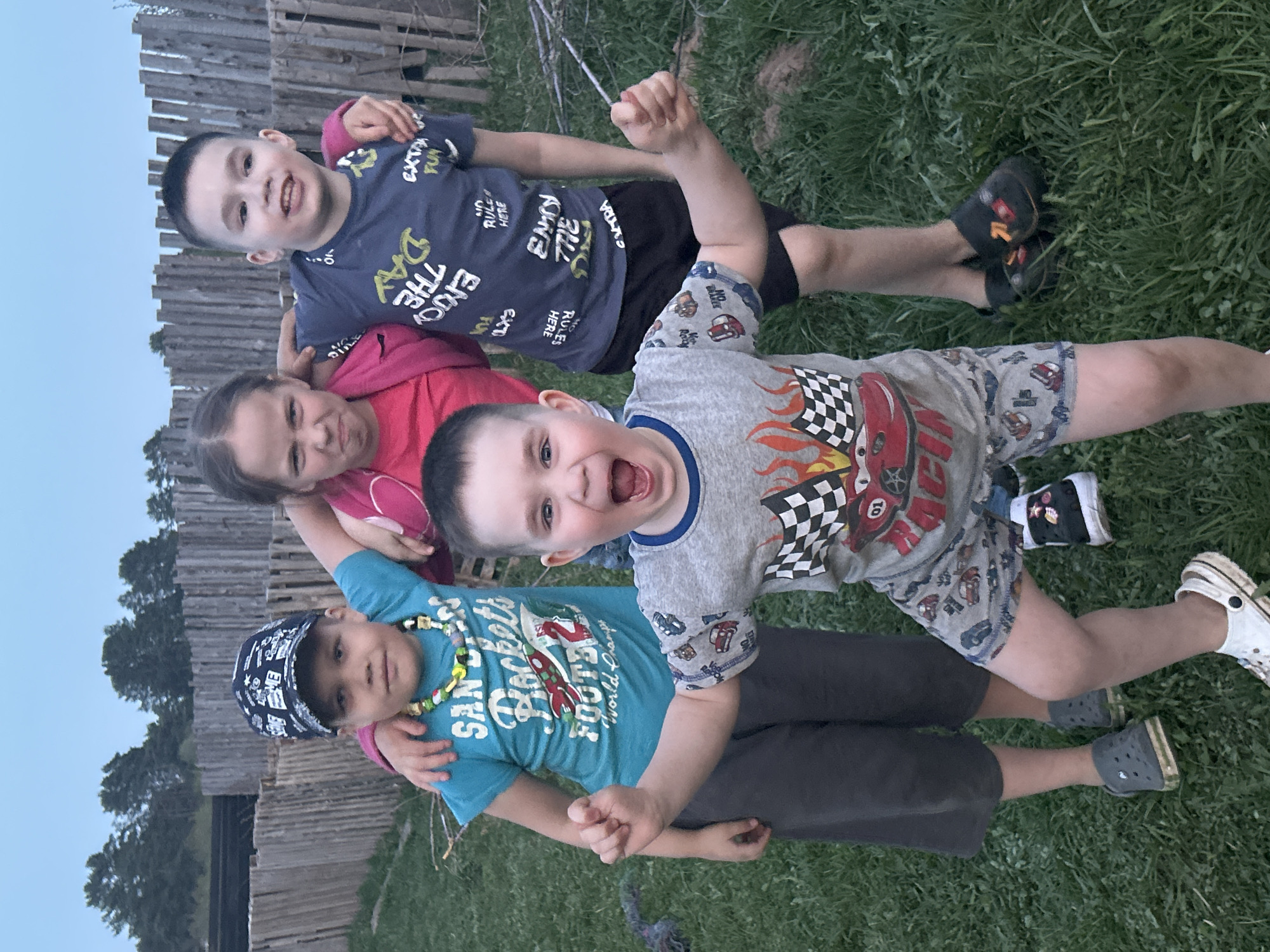 Children play outdoors in grassy area in Rusalevka, Russia