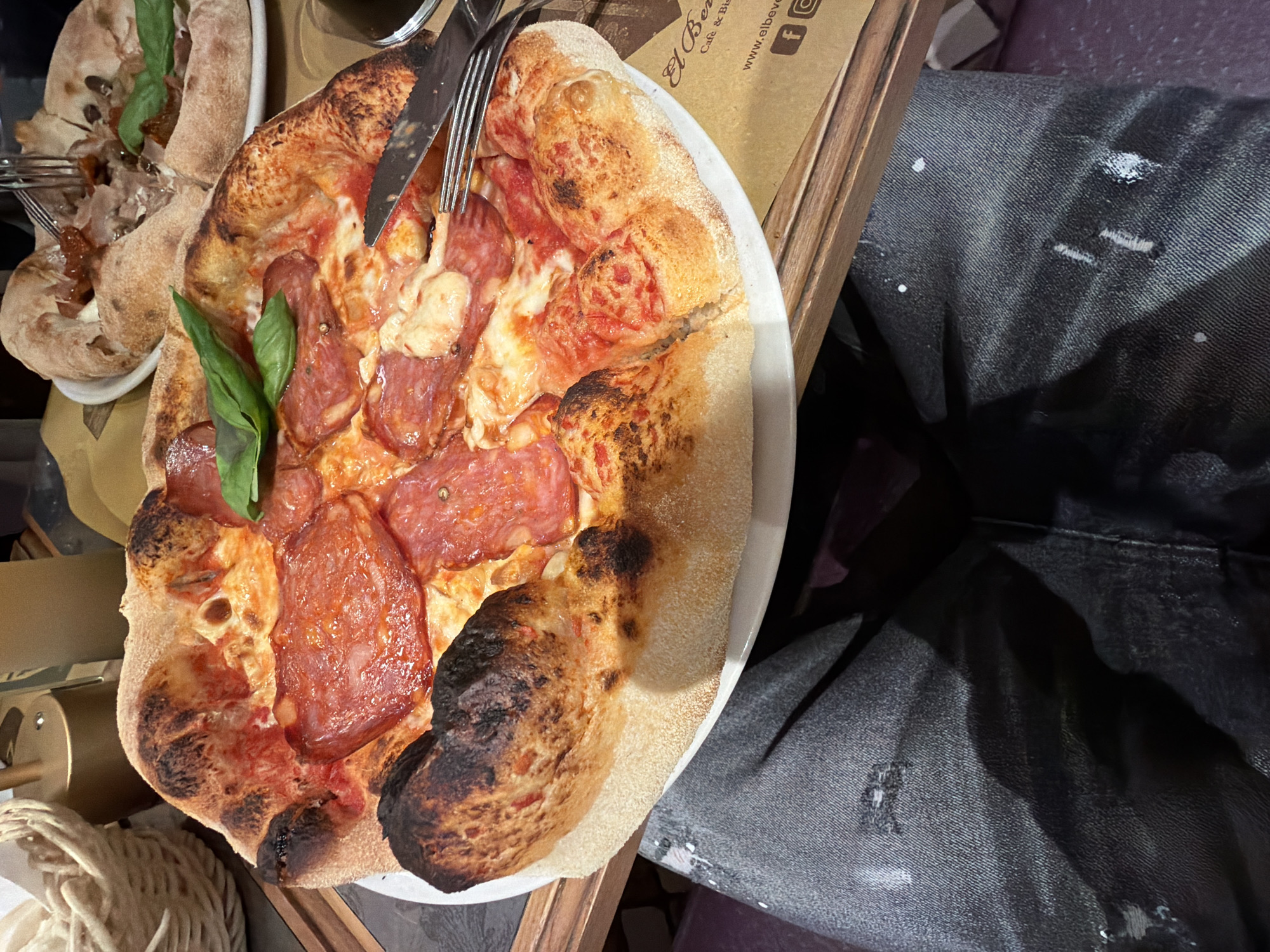 Pizza dinner captured in Milan dining scene