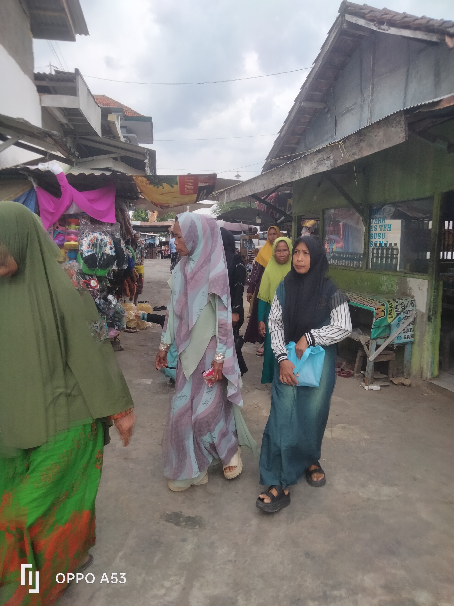 Community gathering at a religious site in Badung, Indonesia
