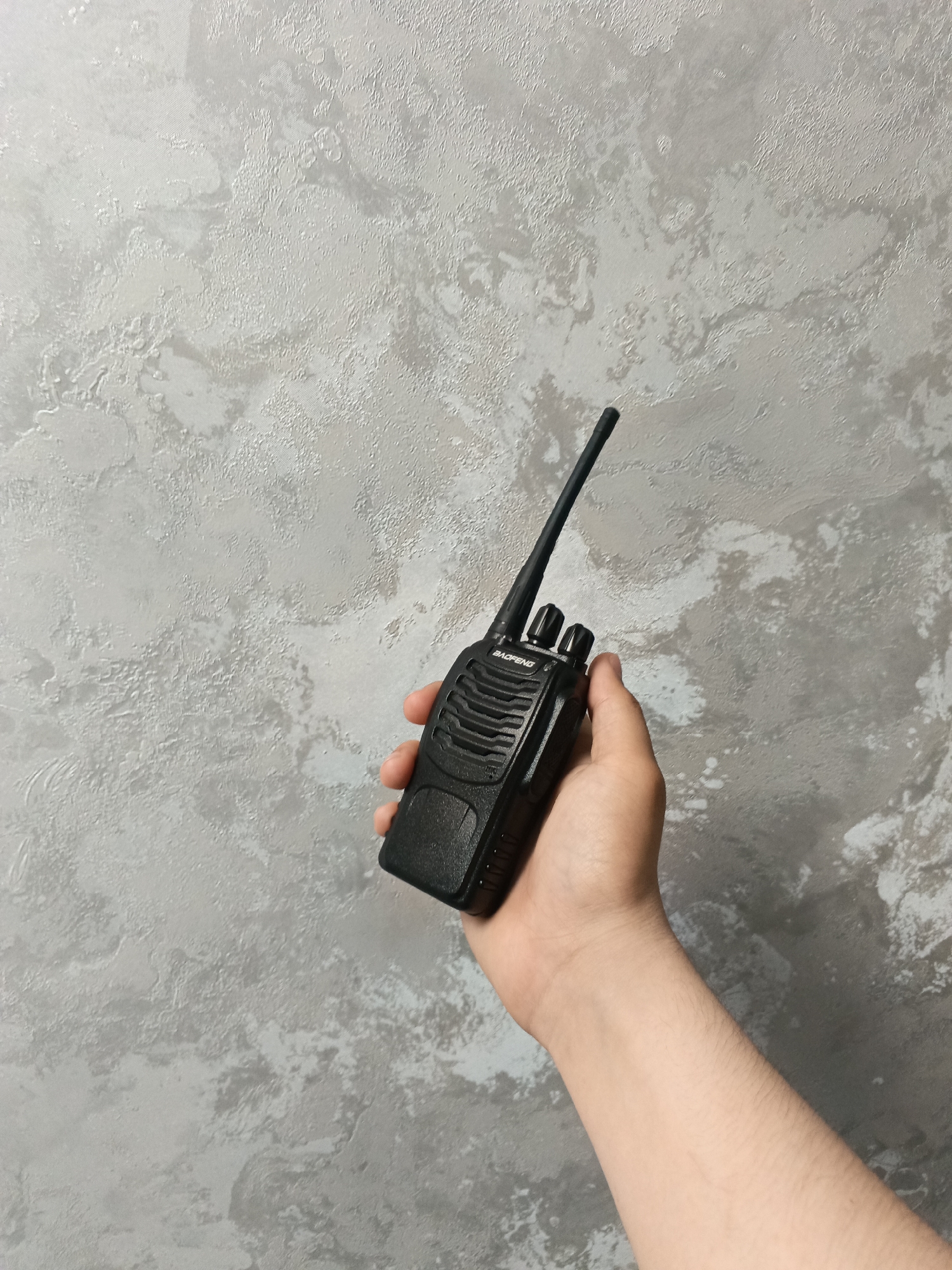 Young man photographs himself with objects in Andreyevo interior