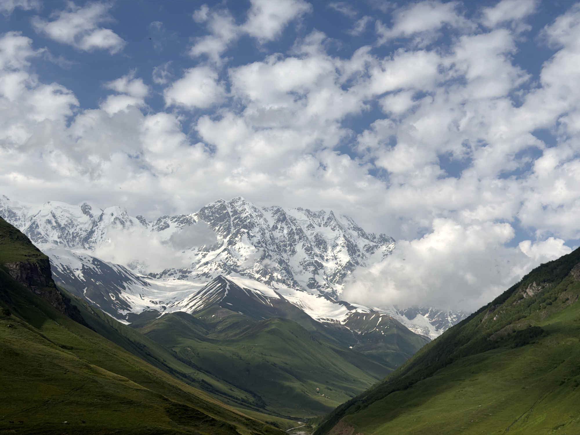 Svan towers and snowy peaks under Georgian mountain skies