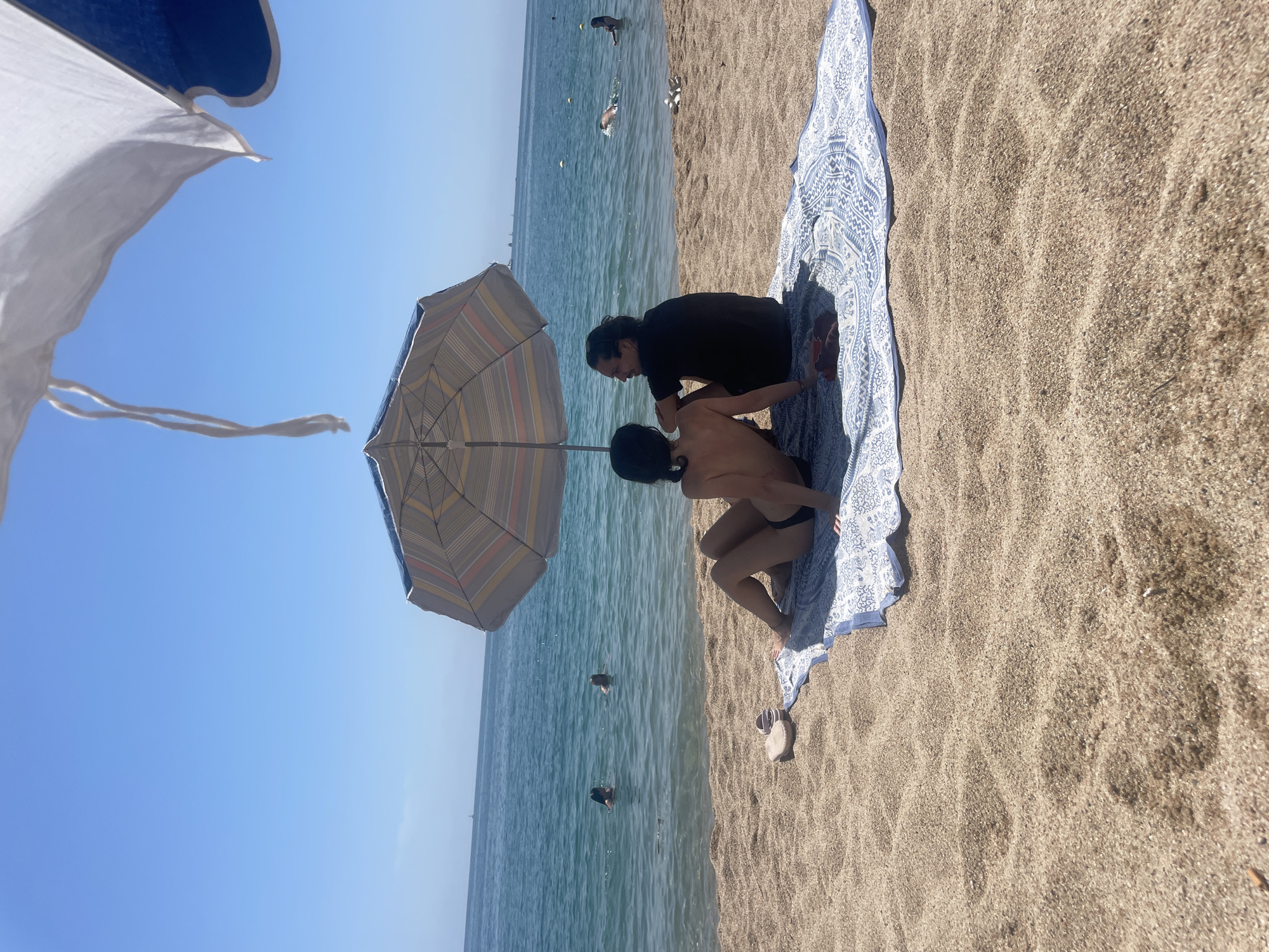 Families enjoy sunny Sunday morning at Arenys de Mar beach