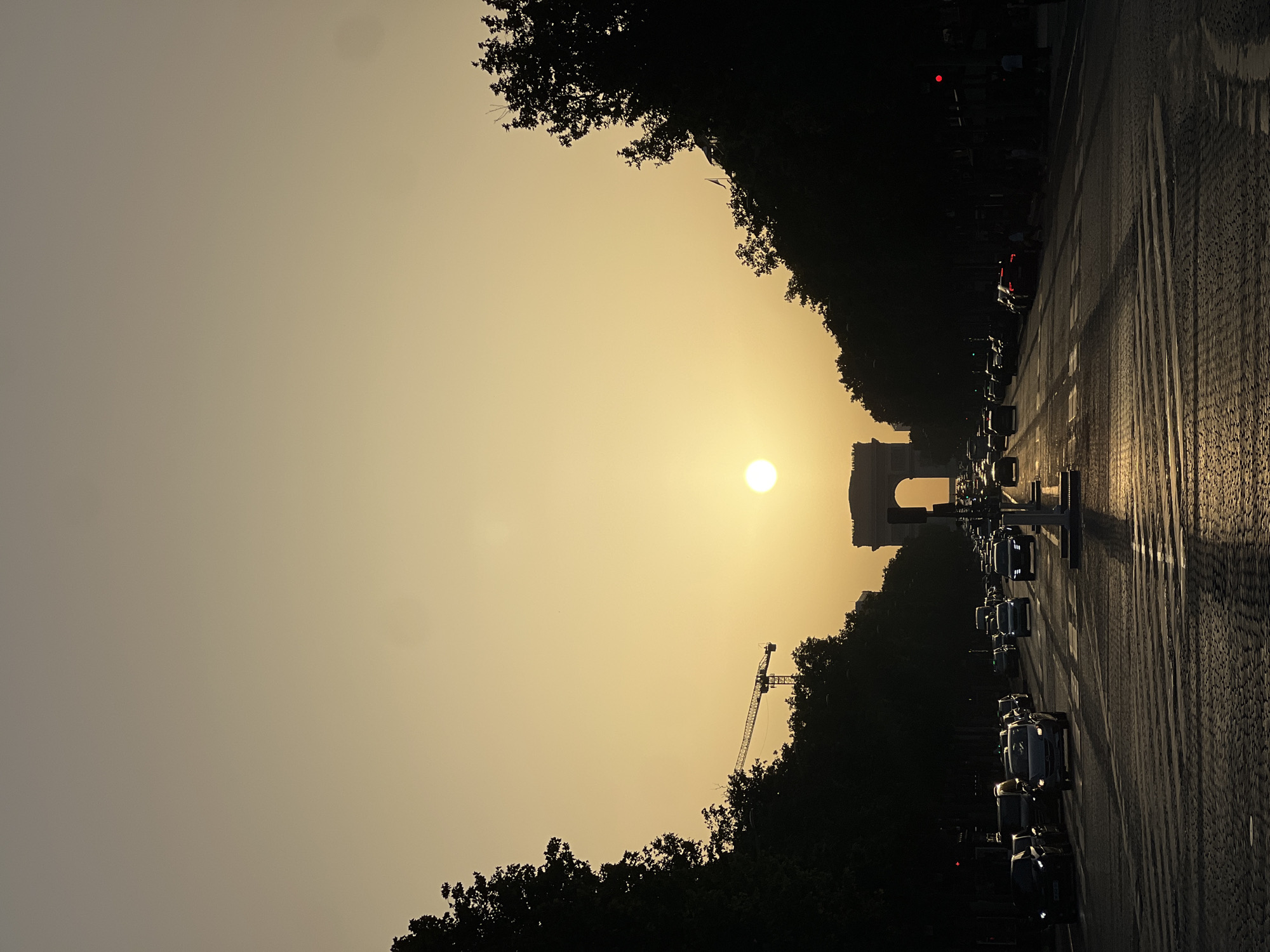 Sunset view of Arc de Triomphe captured in Paris