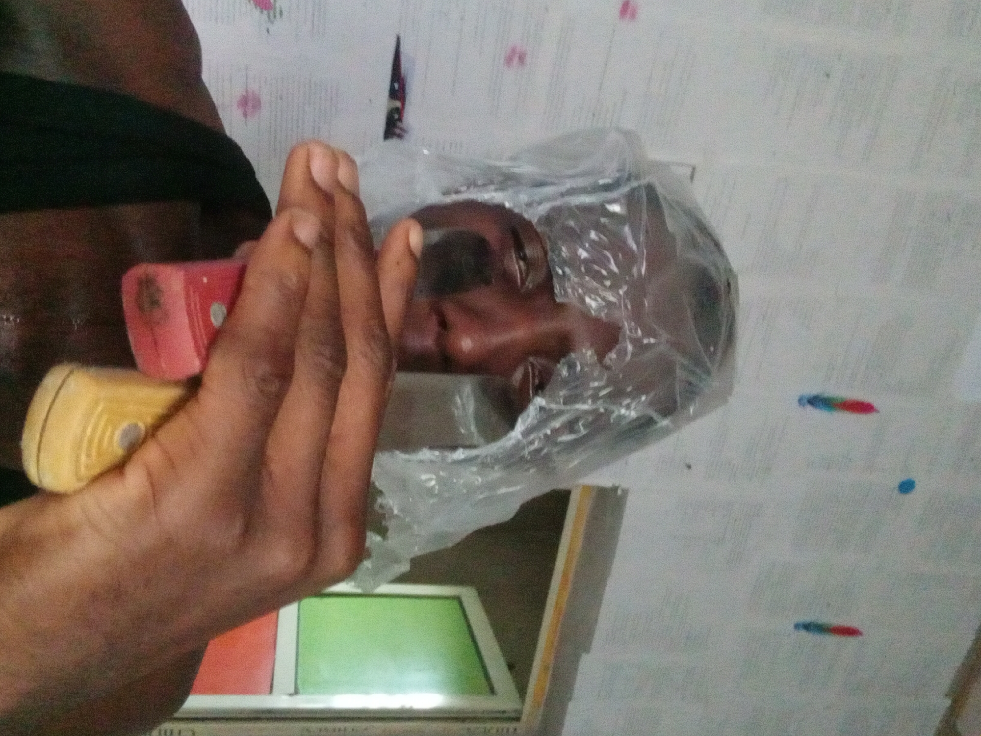 Person documents phone unboxing and daily activities in Akwete
