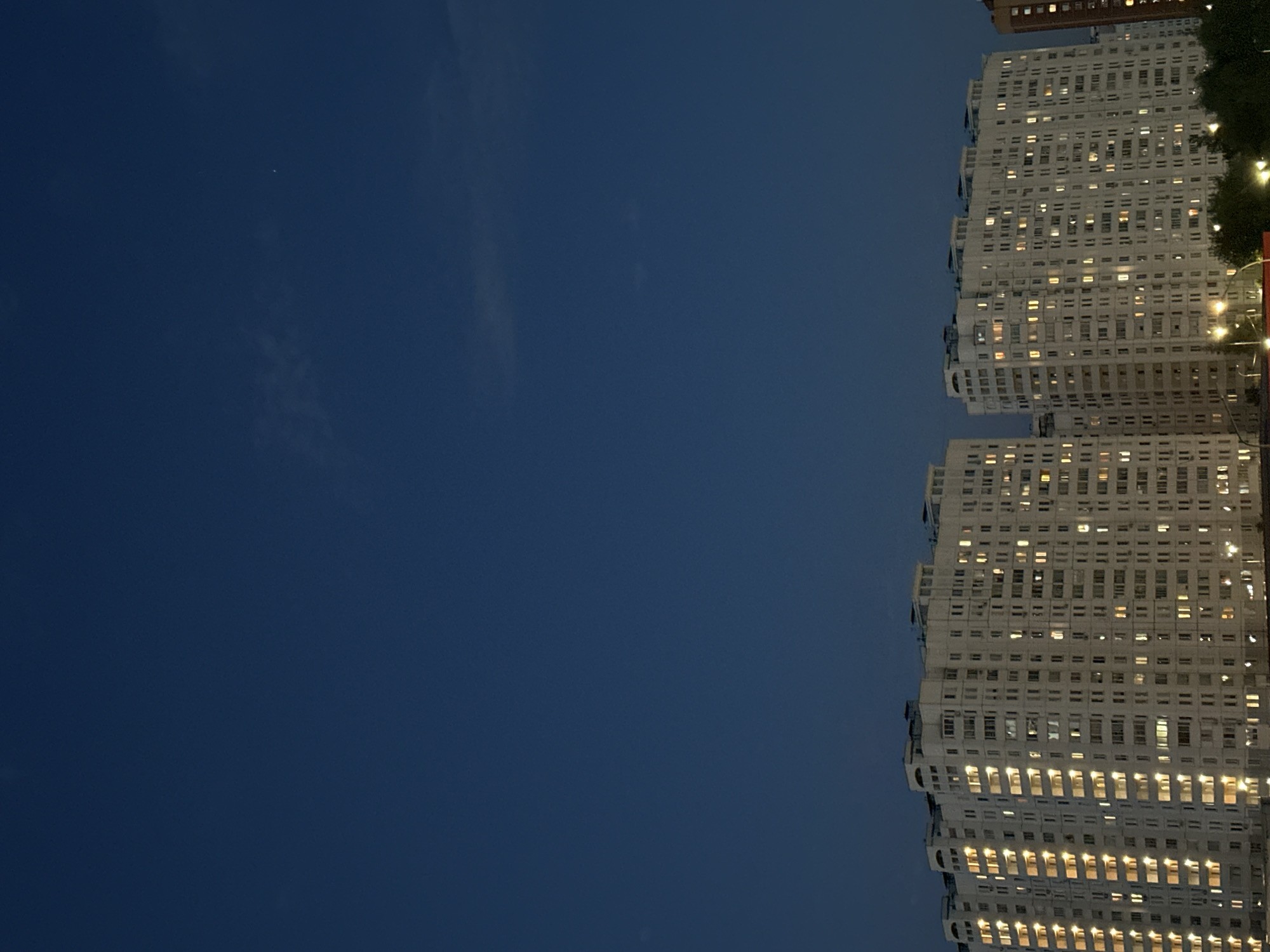 Podolsk residential towers lit up at dusk