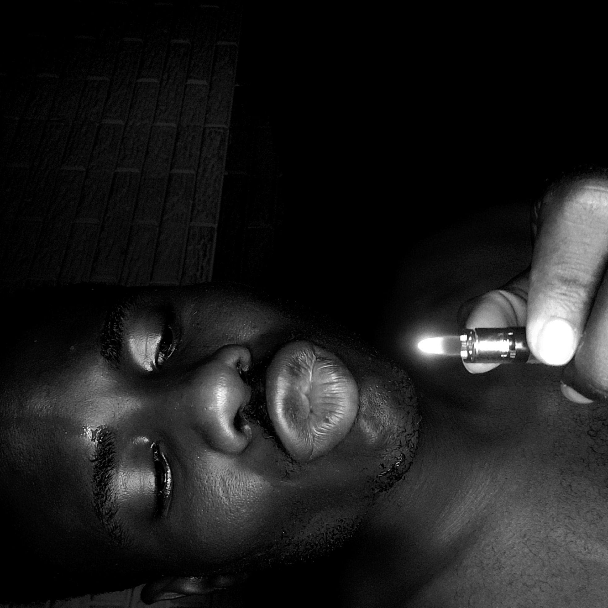 Person photographed with lighter in Narayi, Nigeria