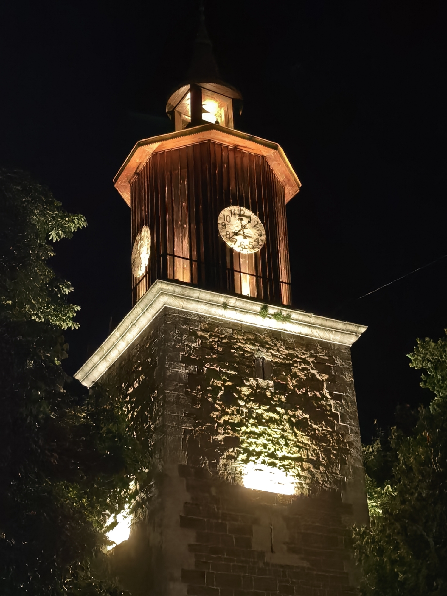 Clock tower illuminated against night sky in Svishtov, Bulgaria