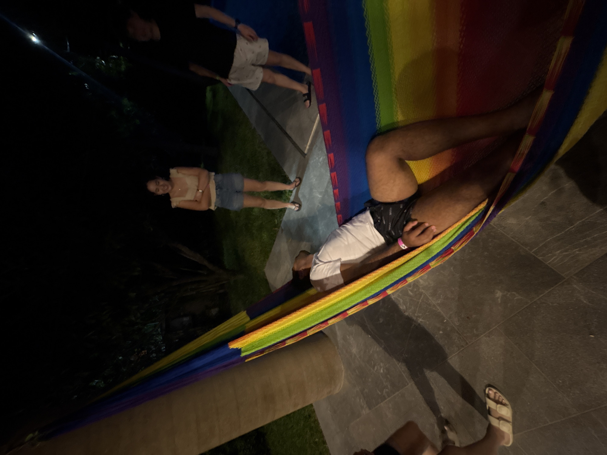 Nighttime hammock relaxation with friends in Puerto Escondido