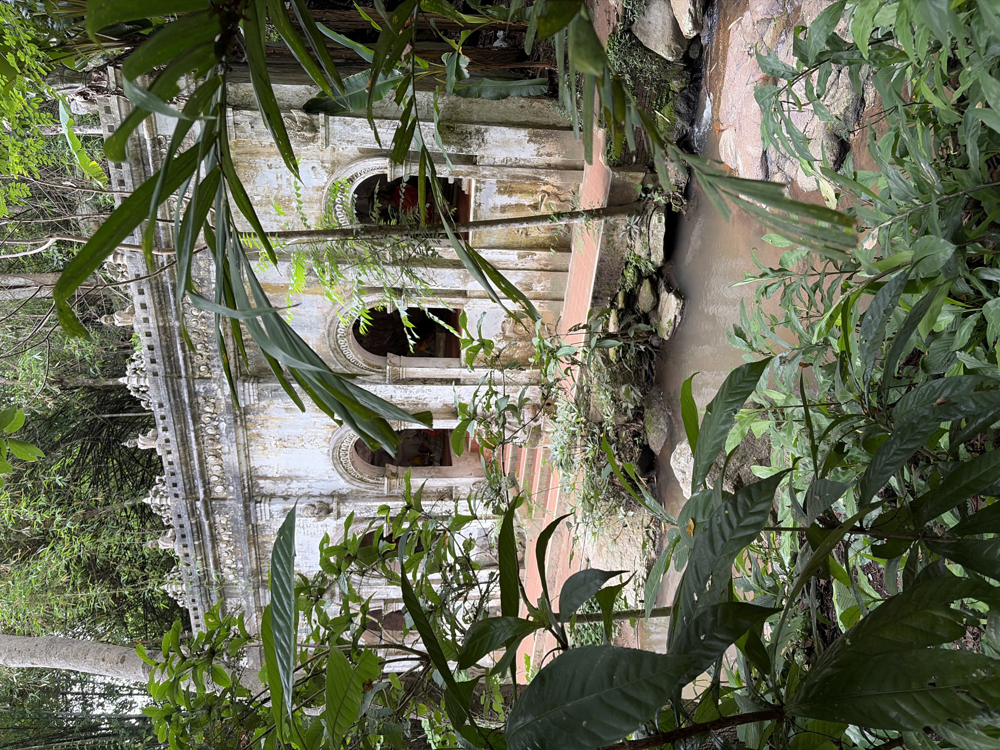 Overgrown stone ruins at Wat Phra That Doi Suthep, Chiang Mai
