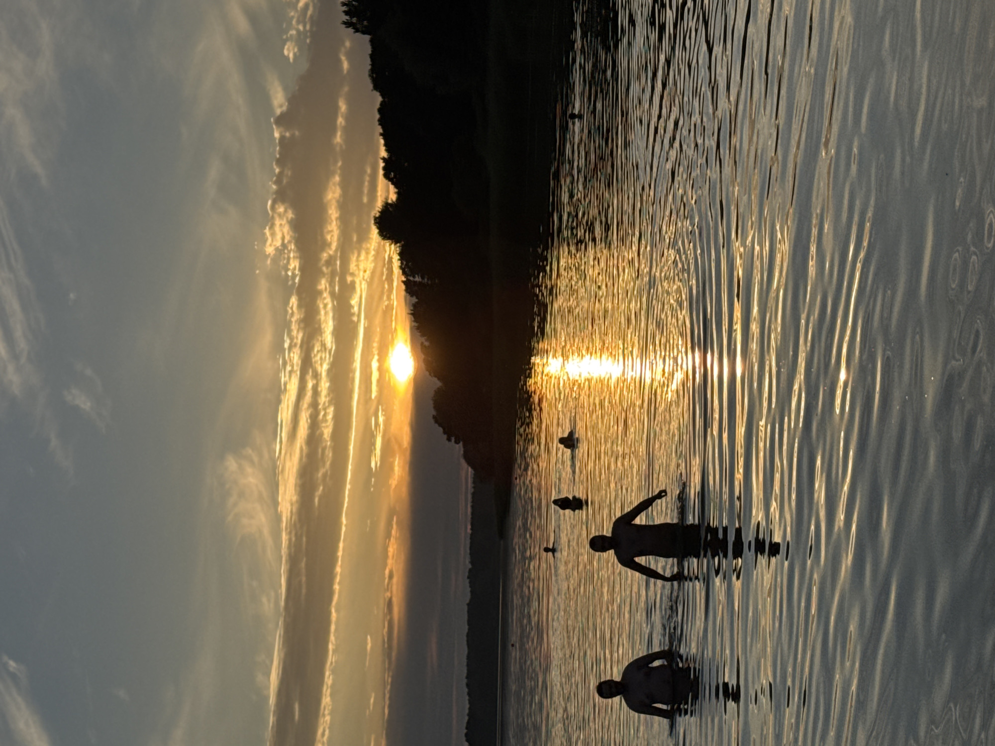 Midsummer evening swim at a Tallinn waterfront sunset