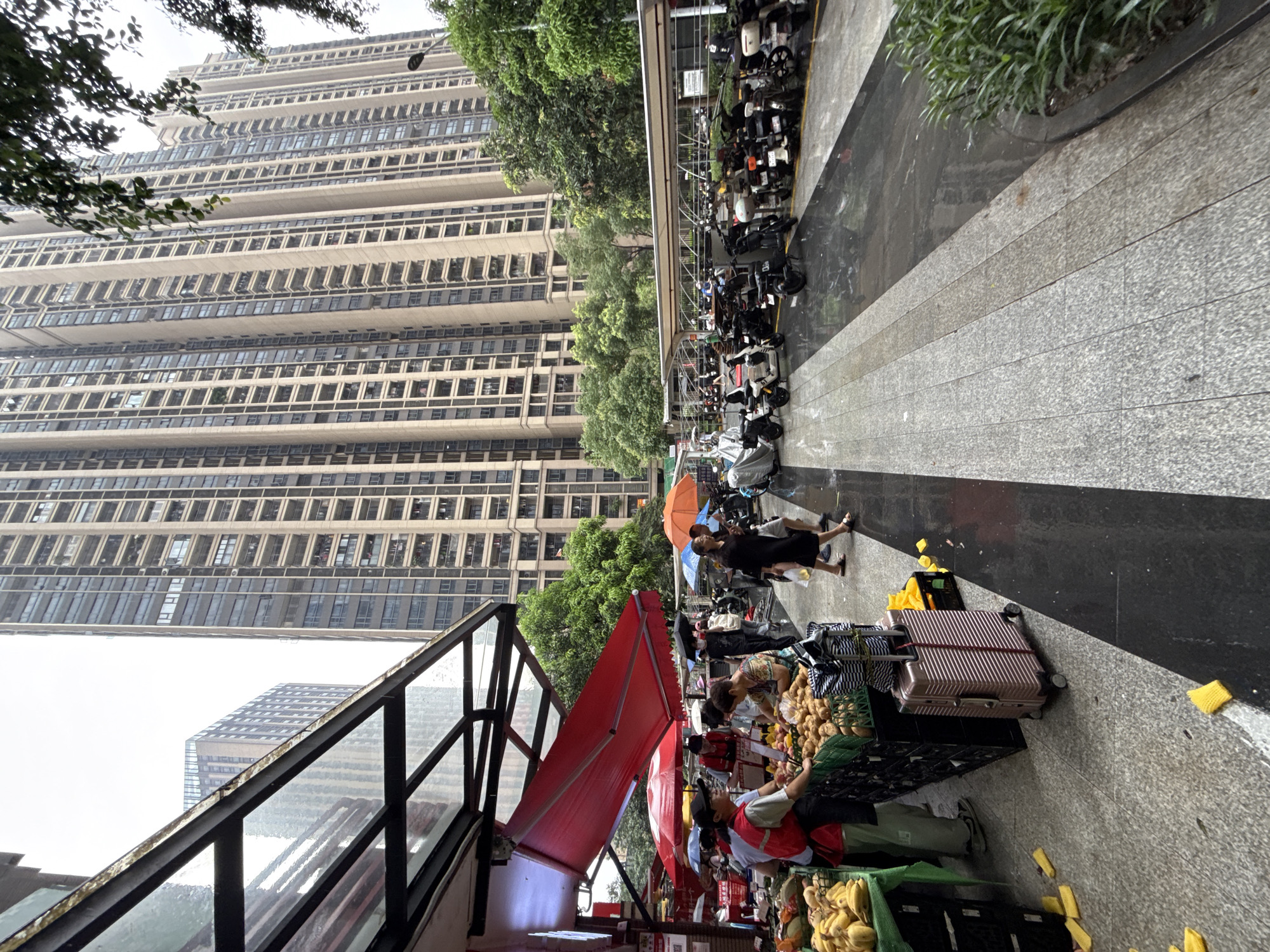 Rainy street market scene in Haizhu District, China