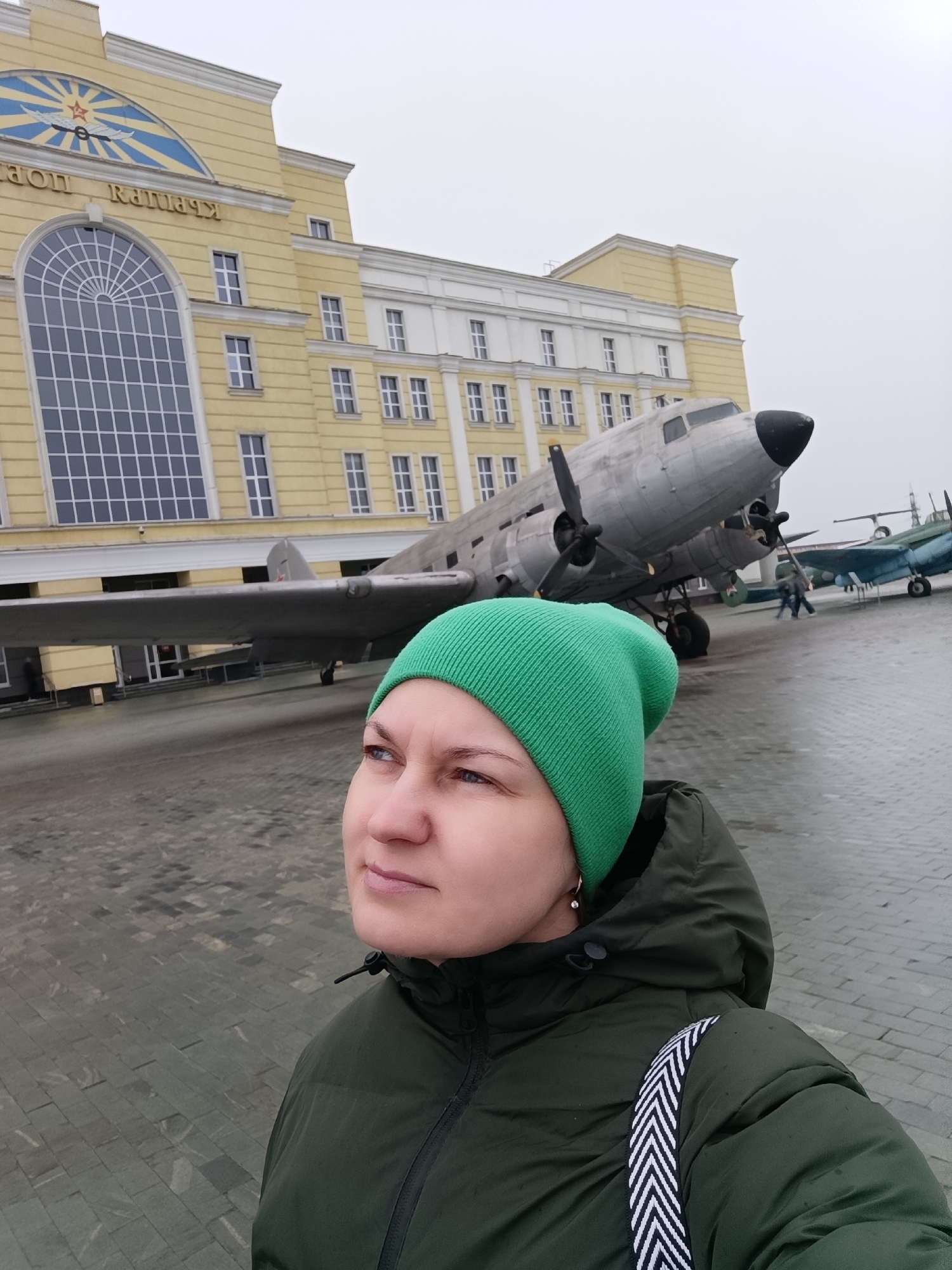 Tourist photographs military equipment at Russian museum exhibition