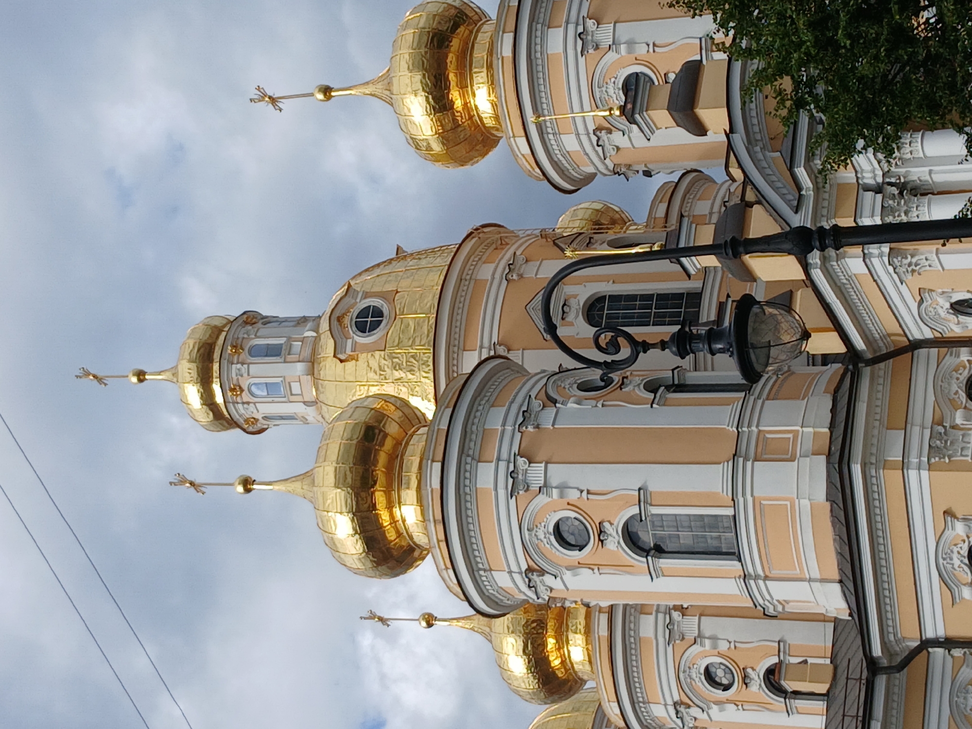 City stroll: street life, parks, and flowers in an Eastern European urban setting.