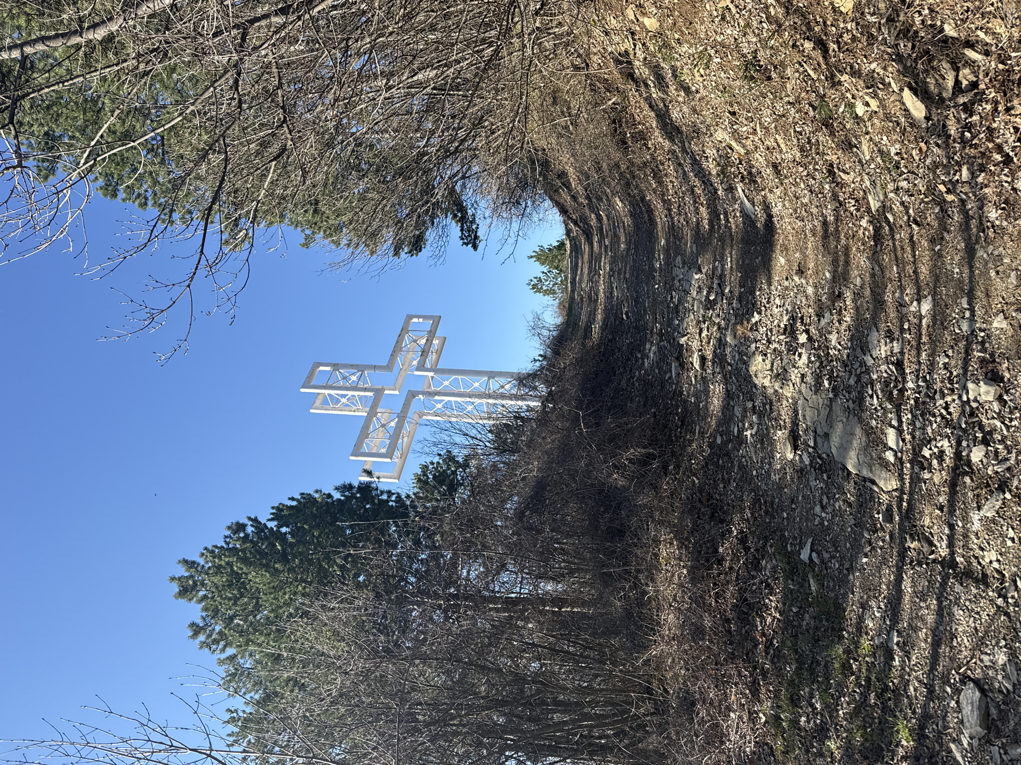 White metal cross documented on rocky slope in Sliven