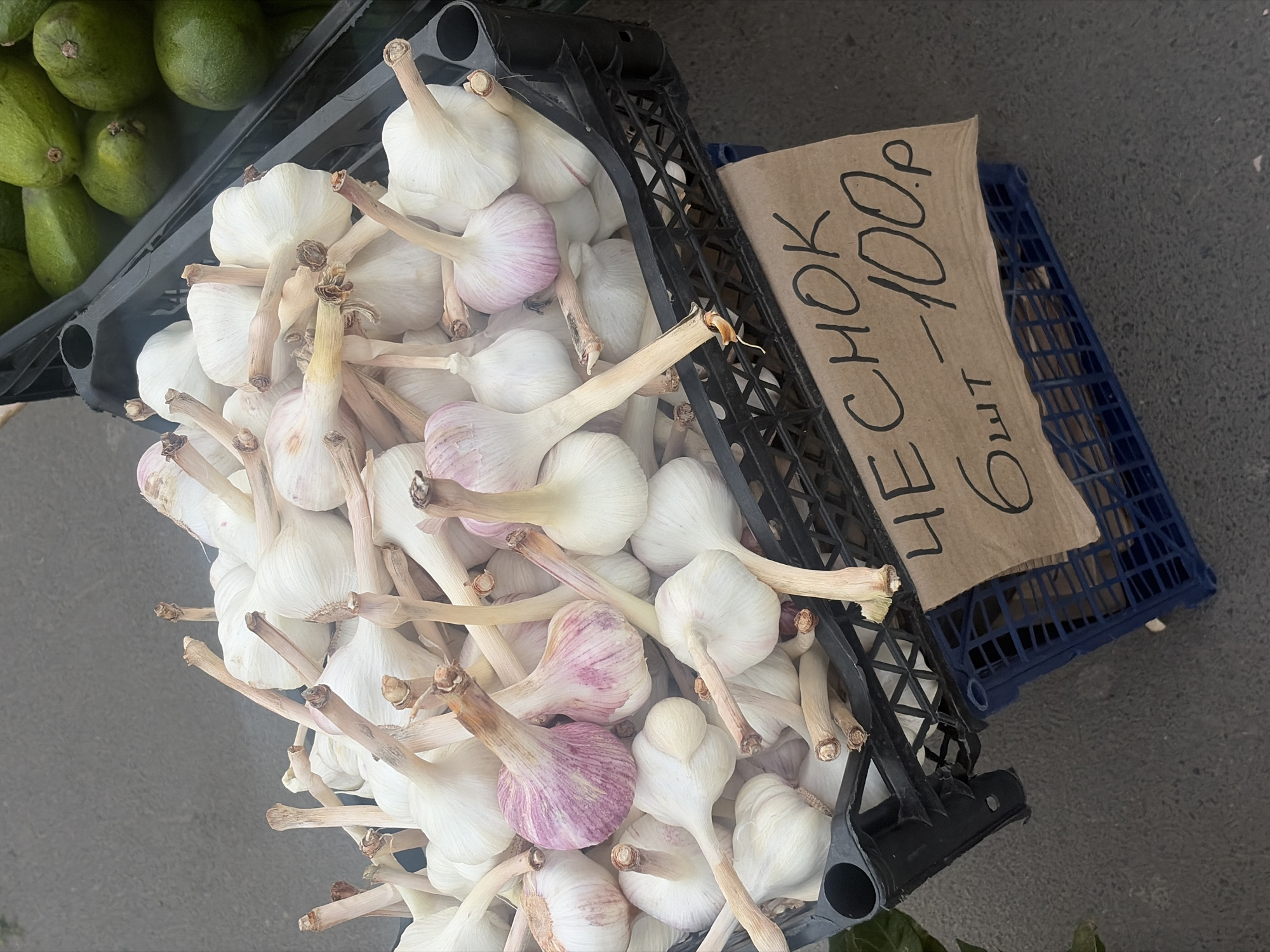 Vendor stalls display produce, balloons at Saint Petersburg market