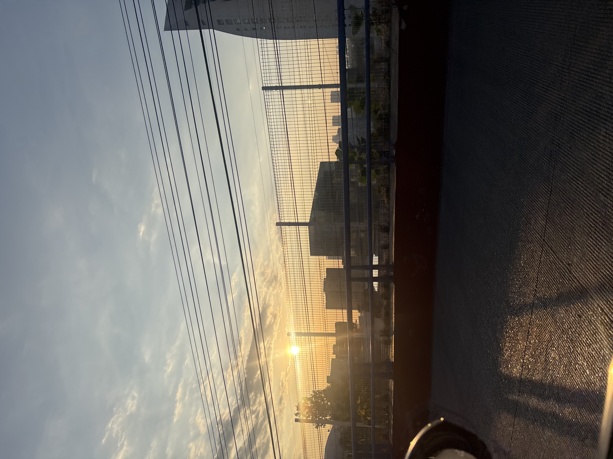 Sunset photographed through fence in Huixquilucan de Degollado, Mexico