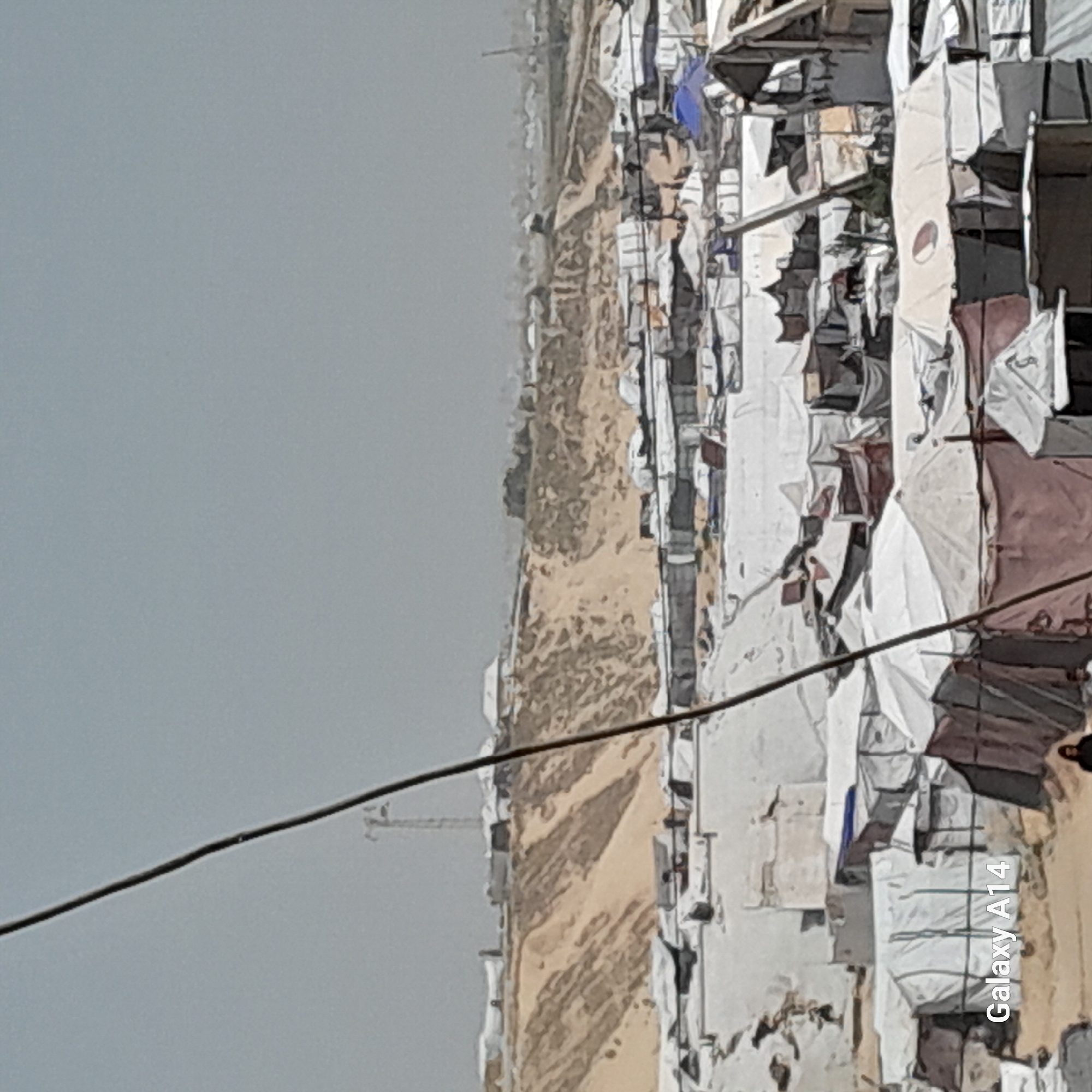 Displacement camp documented in Khan Yunis under overcast skies