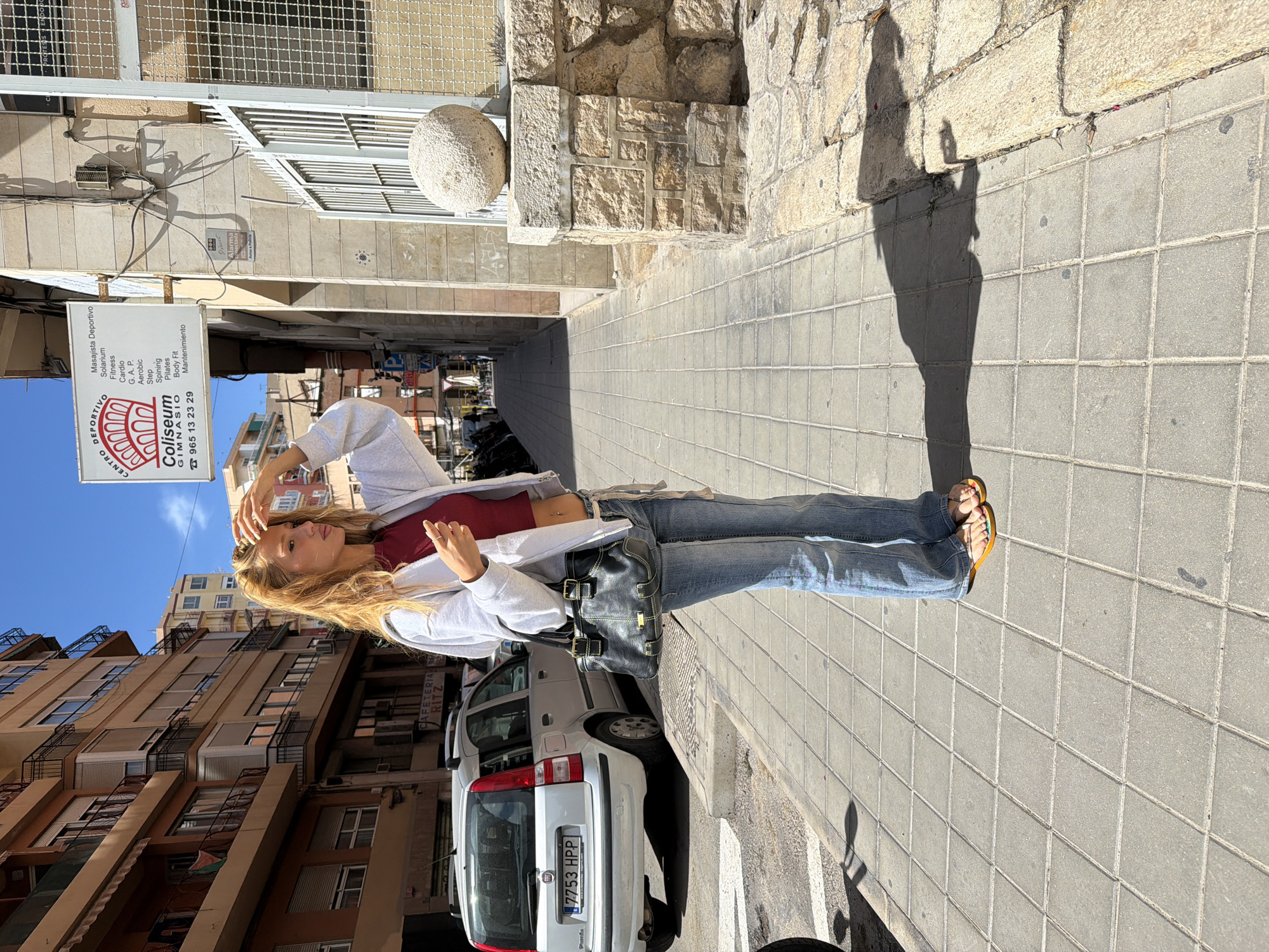 Woman observed on sidewalk in Alicante, Spain