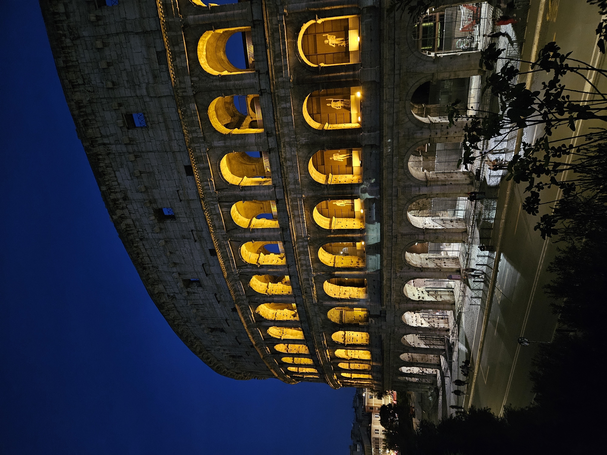 Nighttime illumination of Rome's Colosseum captured by witness
