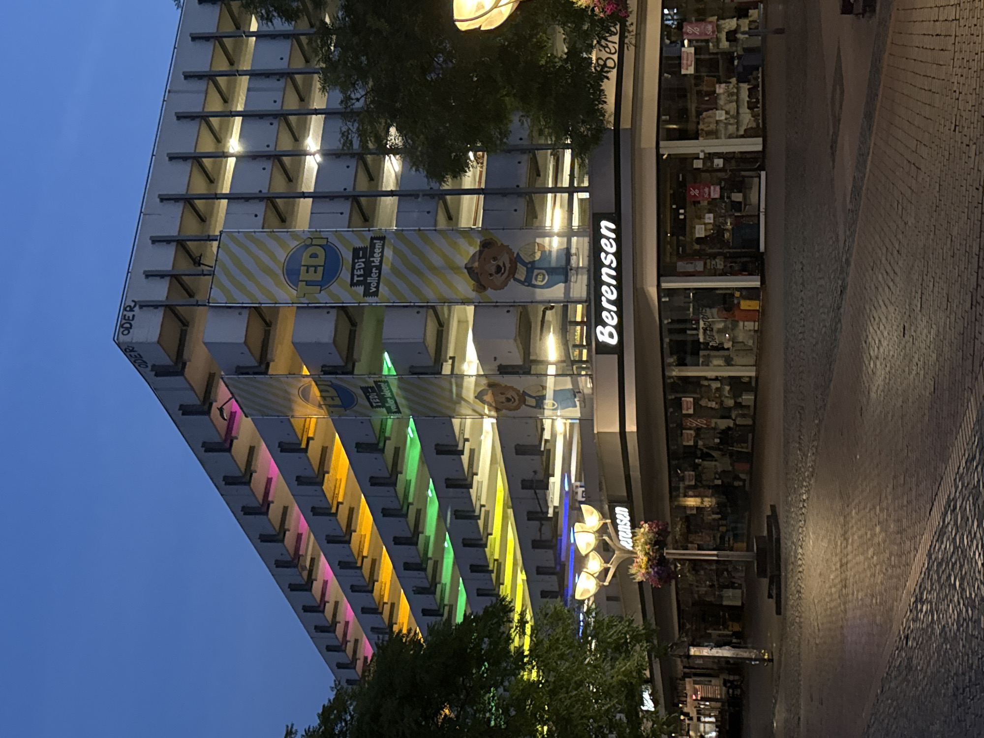 Duisburg streetscape at dusk, colorful garage and office building