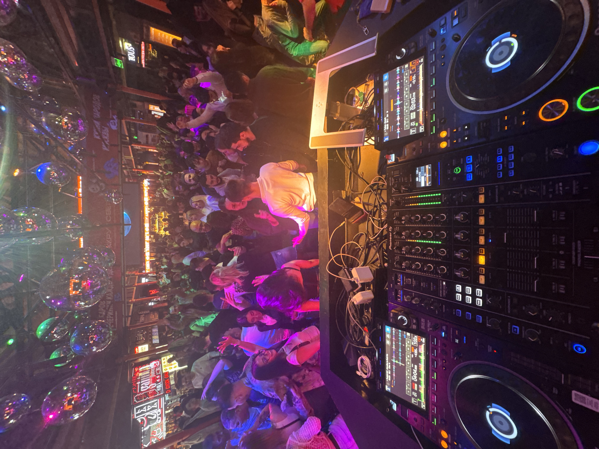 Moscow nightclub captured from DJ booth perspective