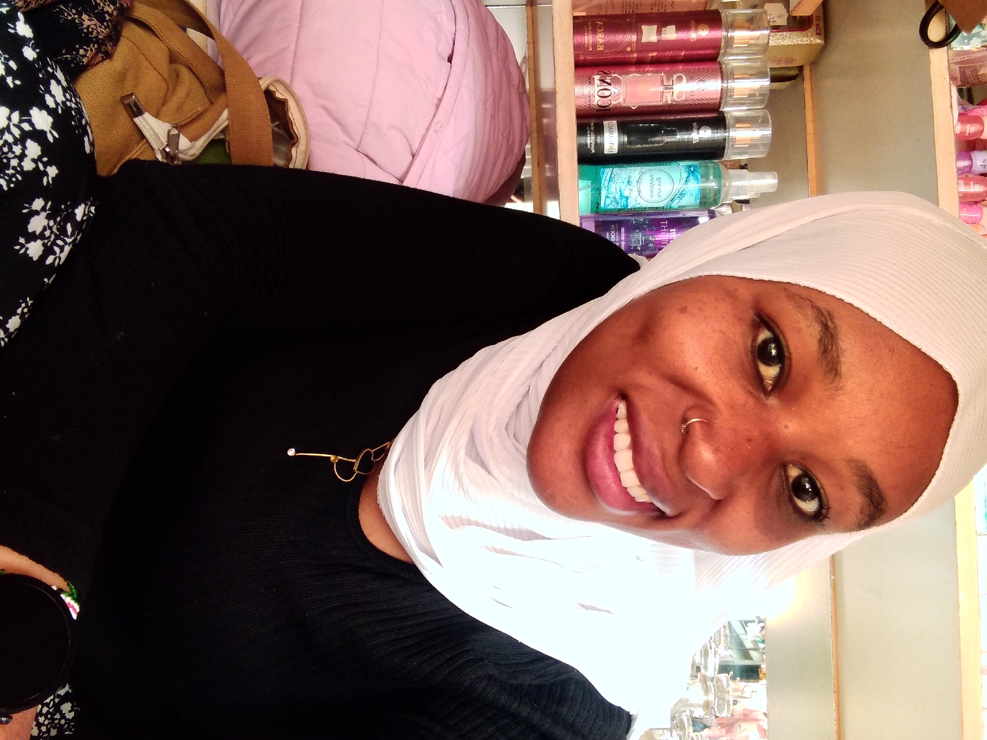 Young woman photographed in portrait session in Nyeri shop
