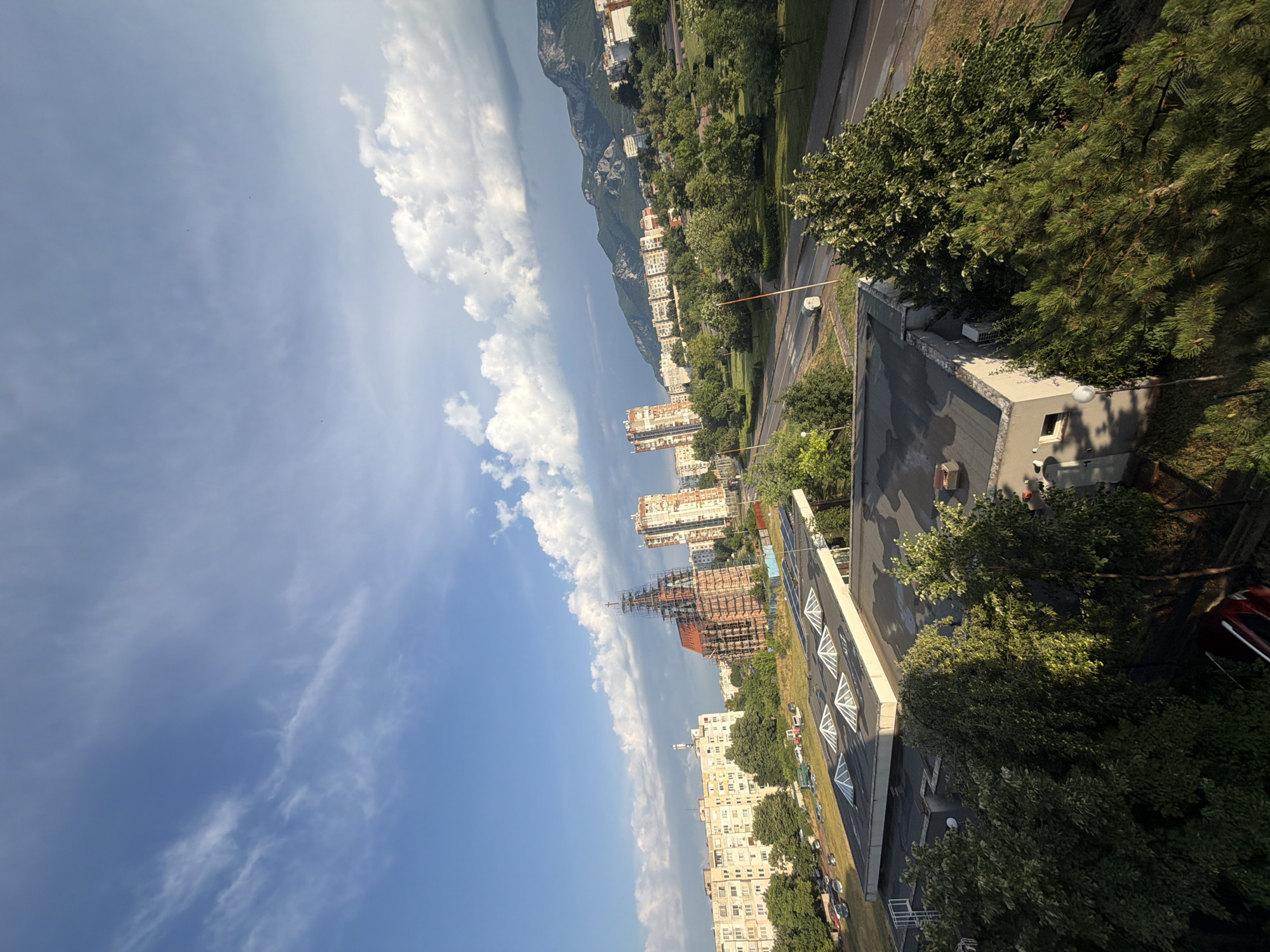 Vratsa from above, city and mountains under a shifting sky