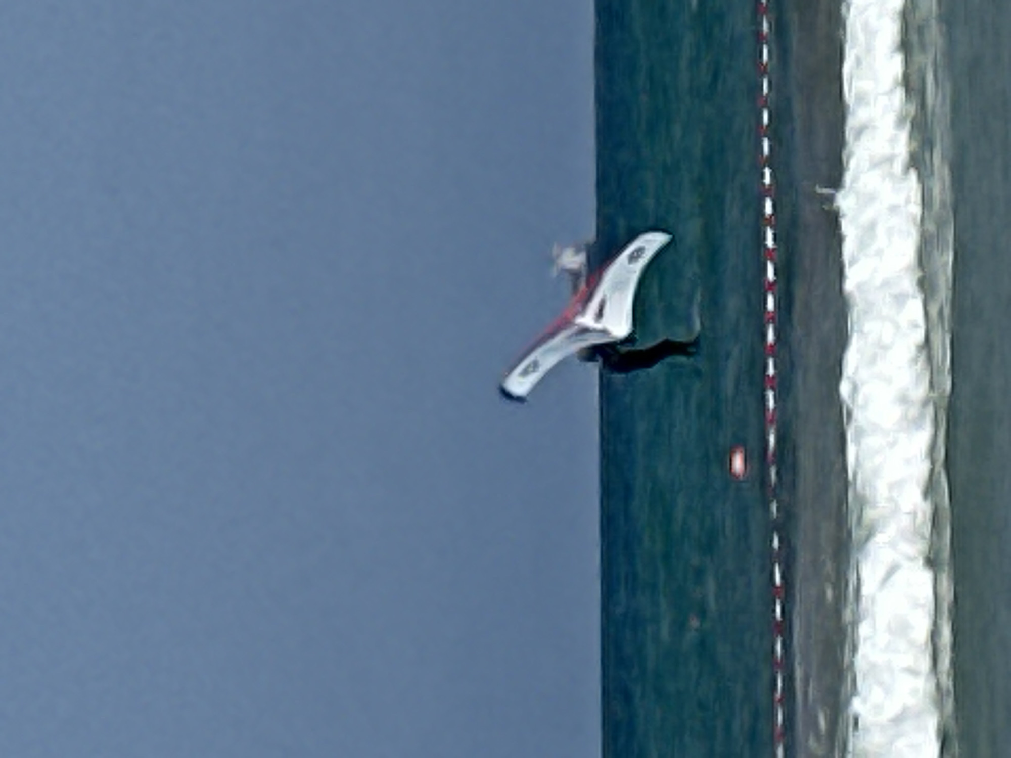 Wing foiling off Kiryat Yam on a calm summer morning