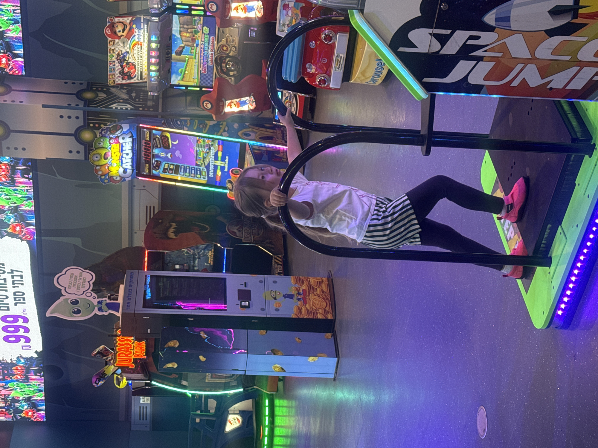 Child plays arcade games at Tel-Aviv gaming center
