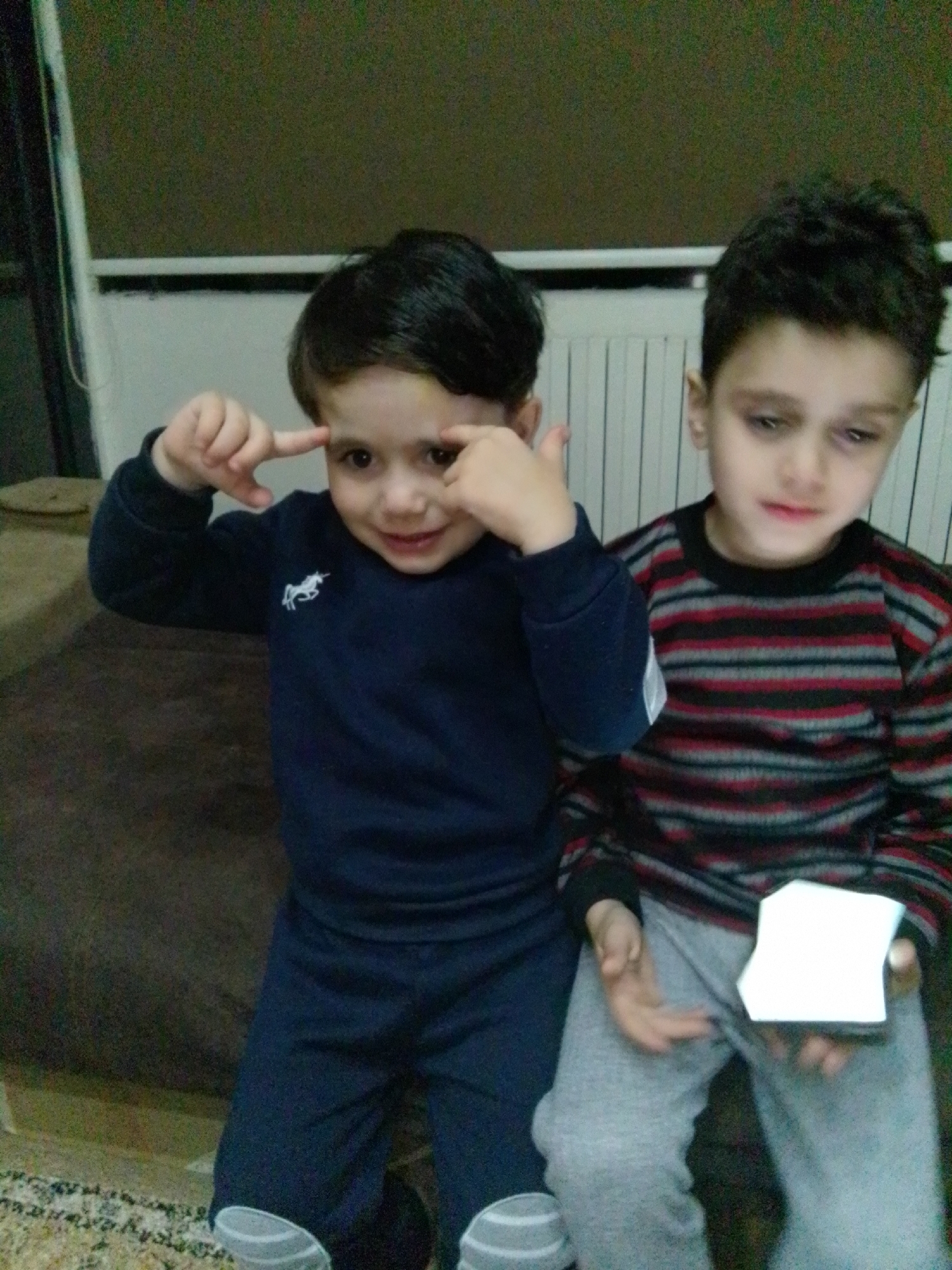 Children's daily moments captured in Syrian household
