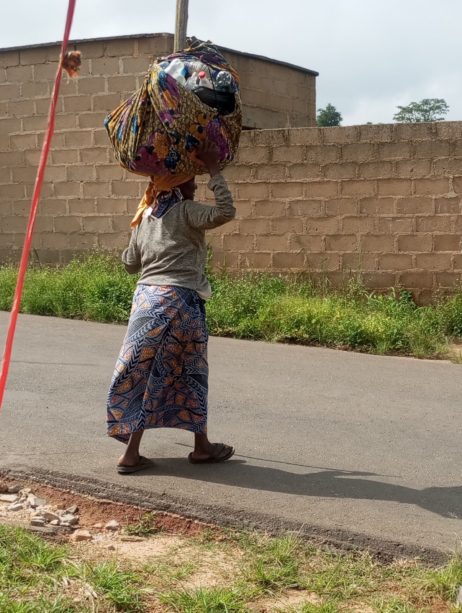 Street life and mobile payment terminals on a Jos road