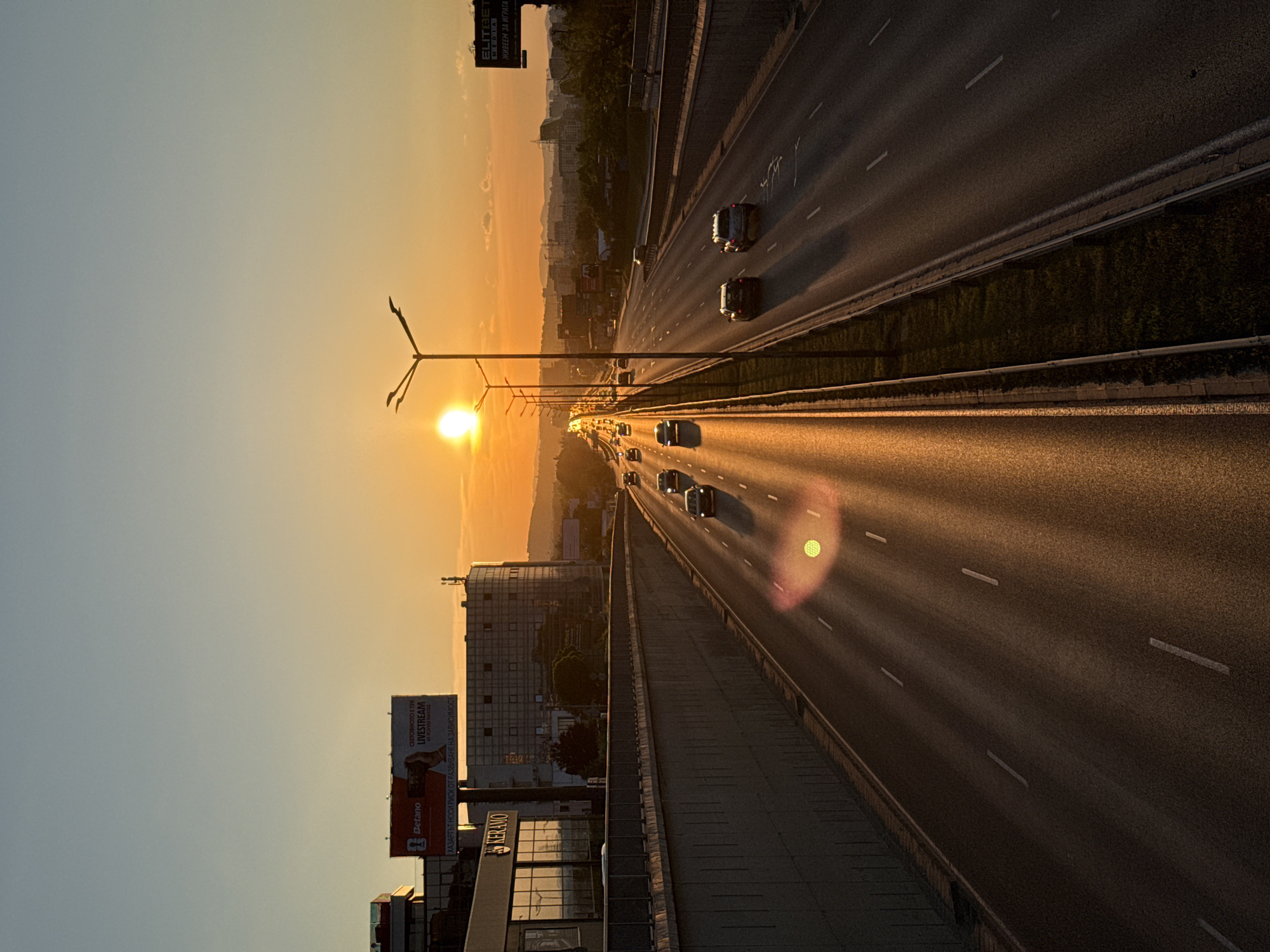 Evening rush hour traffic captured during golden sunset in Sofia