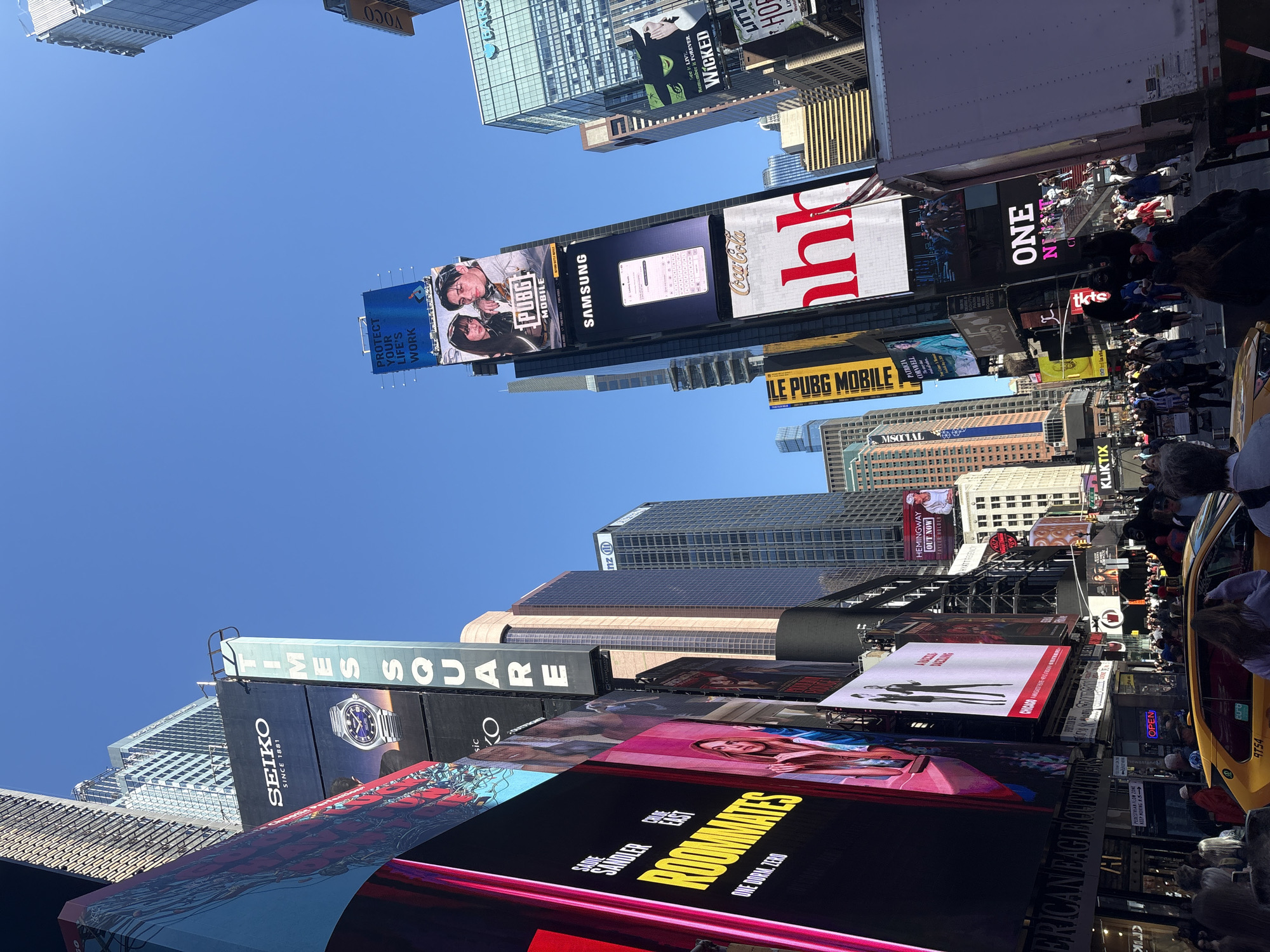 Times Square billboards and skyscrapers captured in upward view