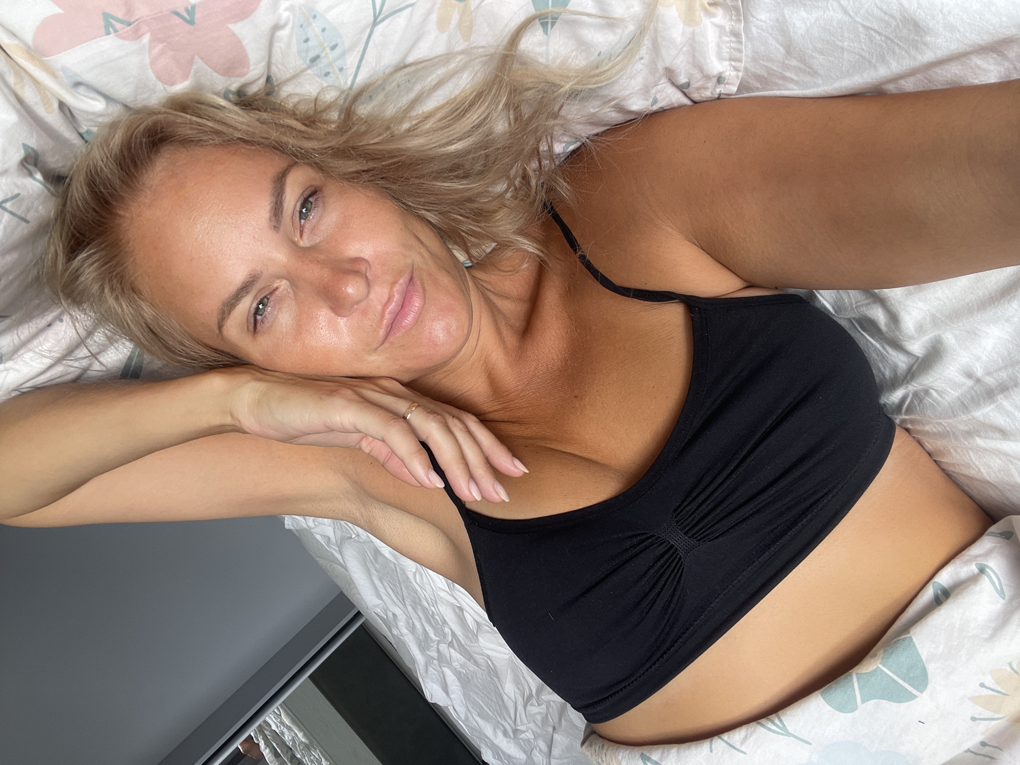 Relaxed morning moment on a sunlit bed in Baranovka
