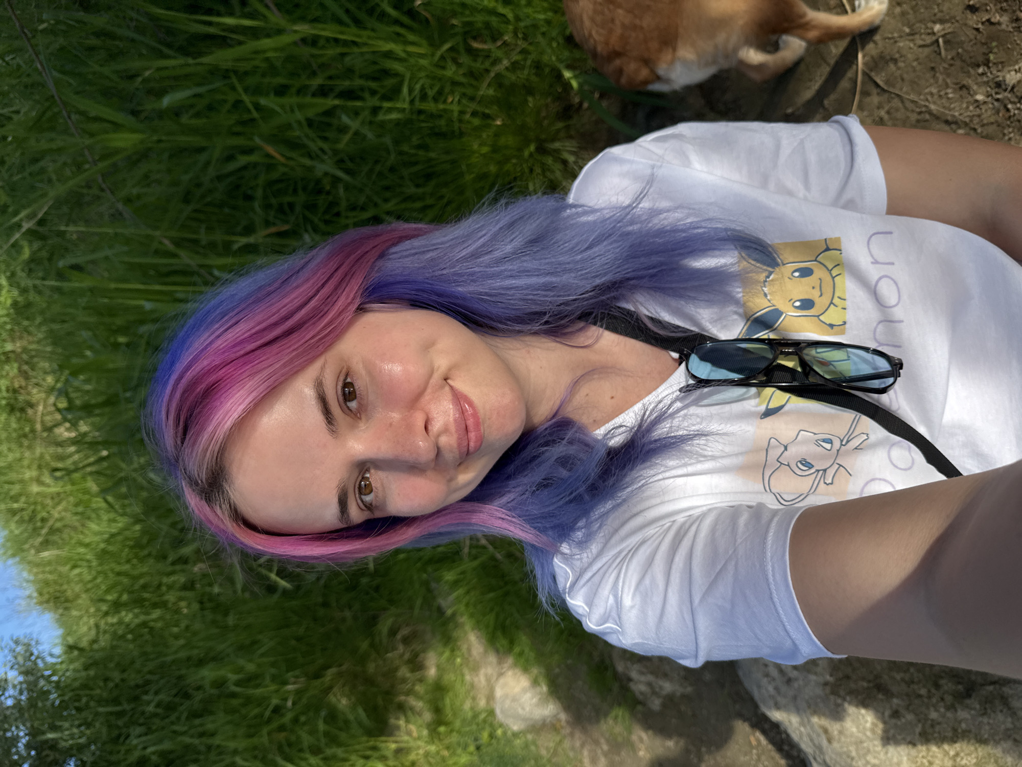 Person with colorful hair enjoys afternoon with dog in Zagreb